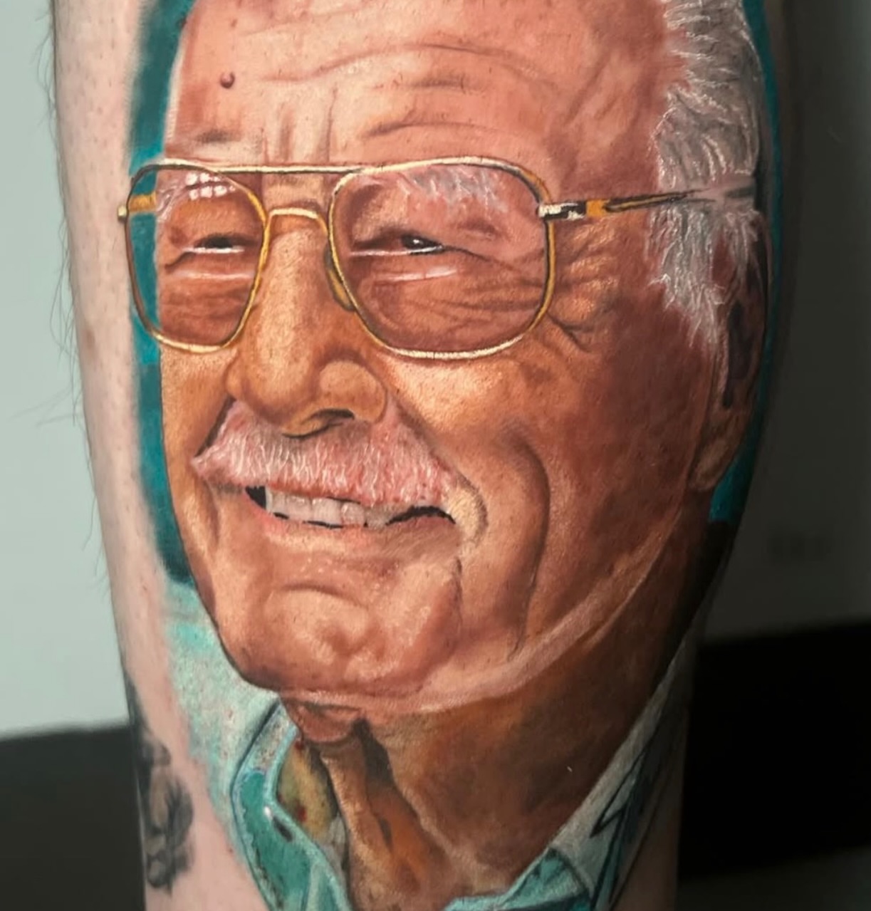 Stan lee realism tattoo on the forearm by Dustin Kaiser, Mentor, Ohio