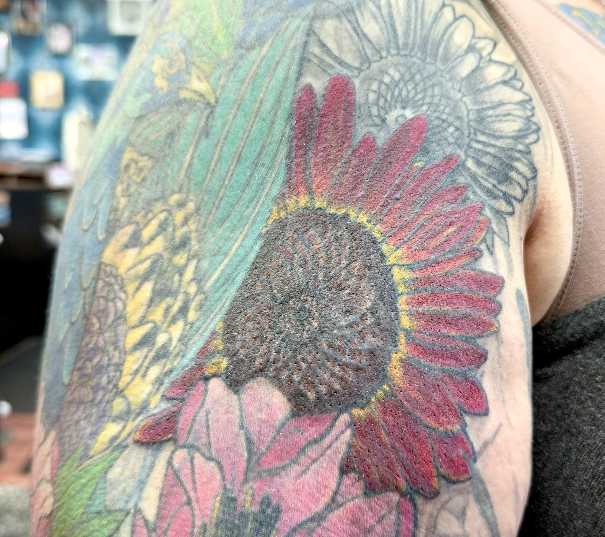 Sunflower dotwork tattoo on the shoulder by @lady_raven_tattoo