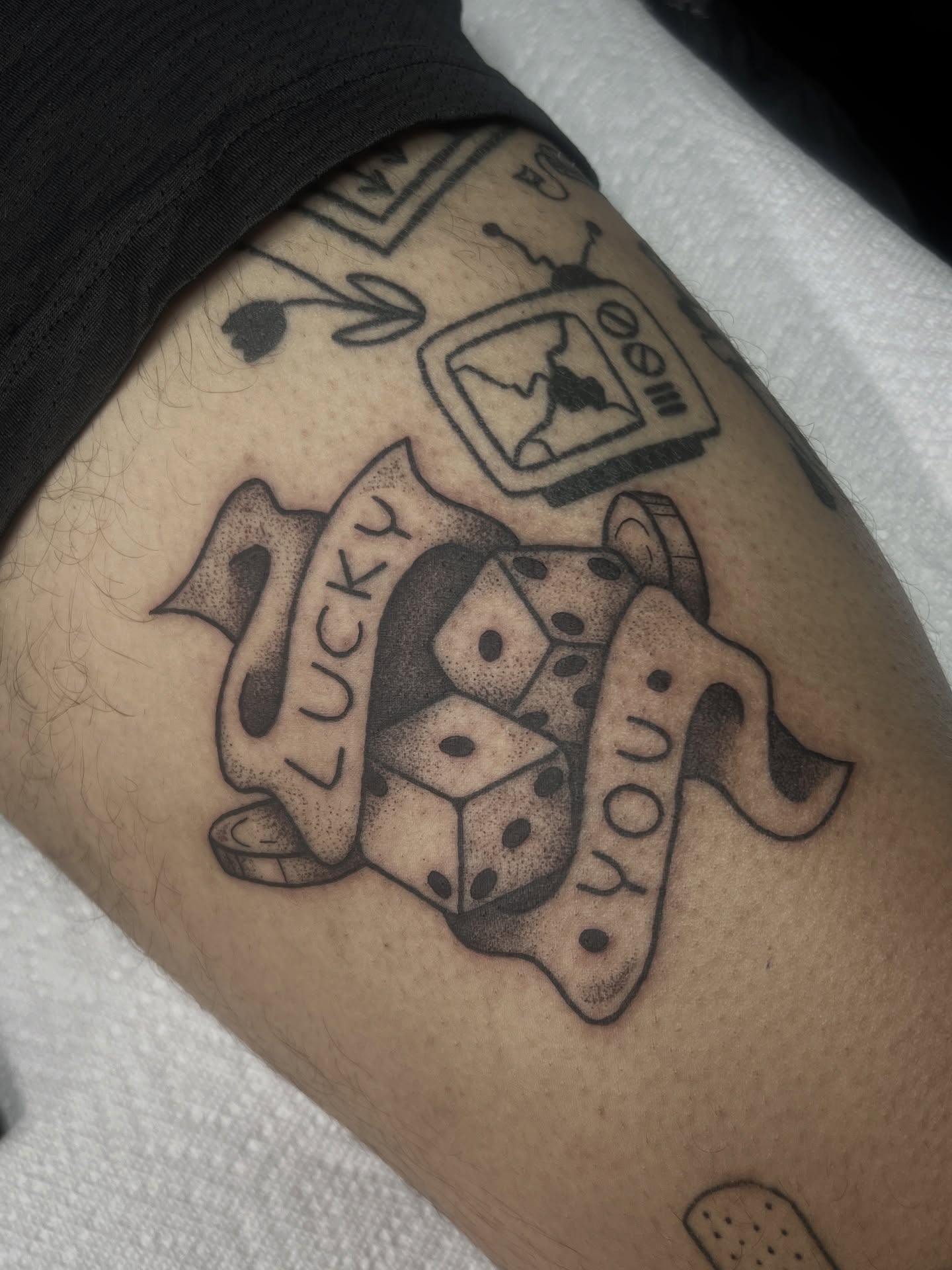 Dice and banner dotwork tattoo on the forearm by 𝑴𝒂𝒚𝒂𖤐𝑫𝒆𝑽𝒊𝒏𝒆, Dayton, Ohio
