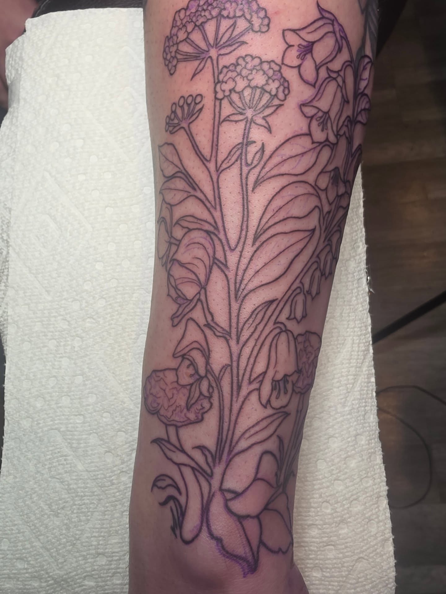 Floral arrangement black and grey tattoo on the forearm by Cassieal Welch