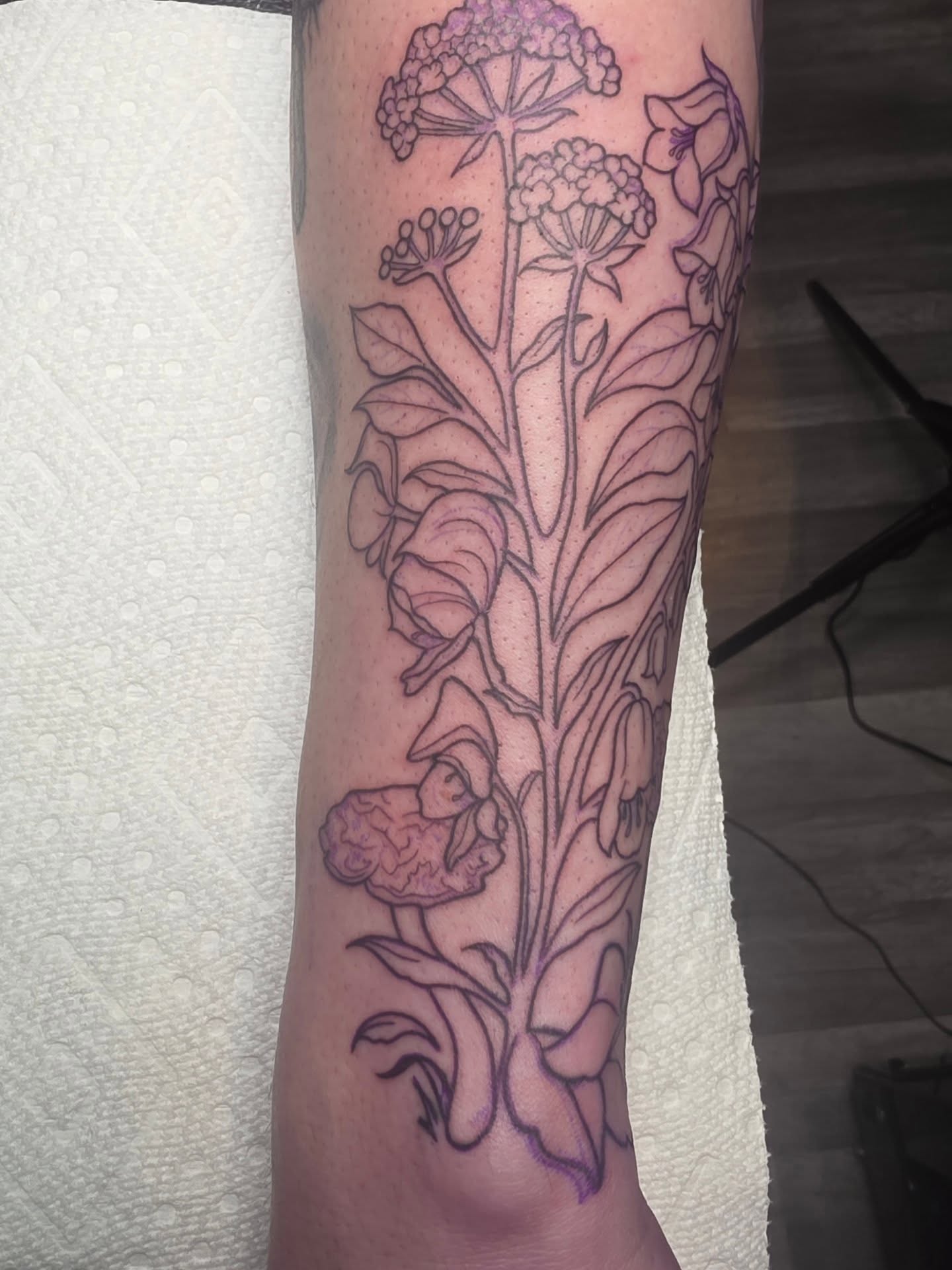 Botanical flowers black and grey tattoo on the forearm by Cassieal Welch