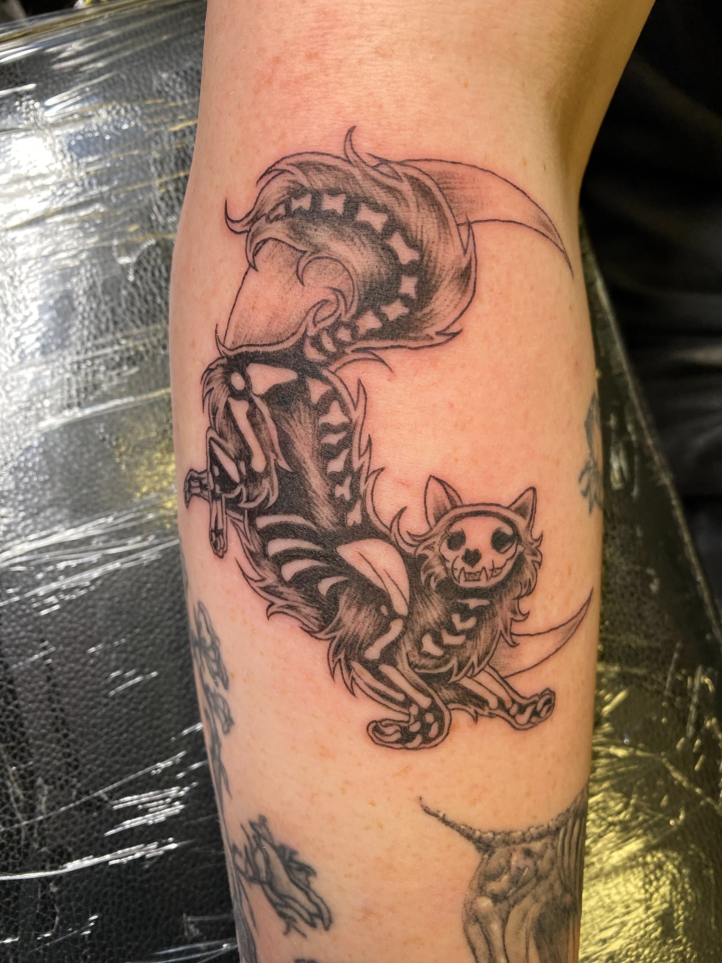 Horse and dog black and grey tattoo on the forearm by Mack ๐ Utah Tattoos