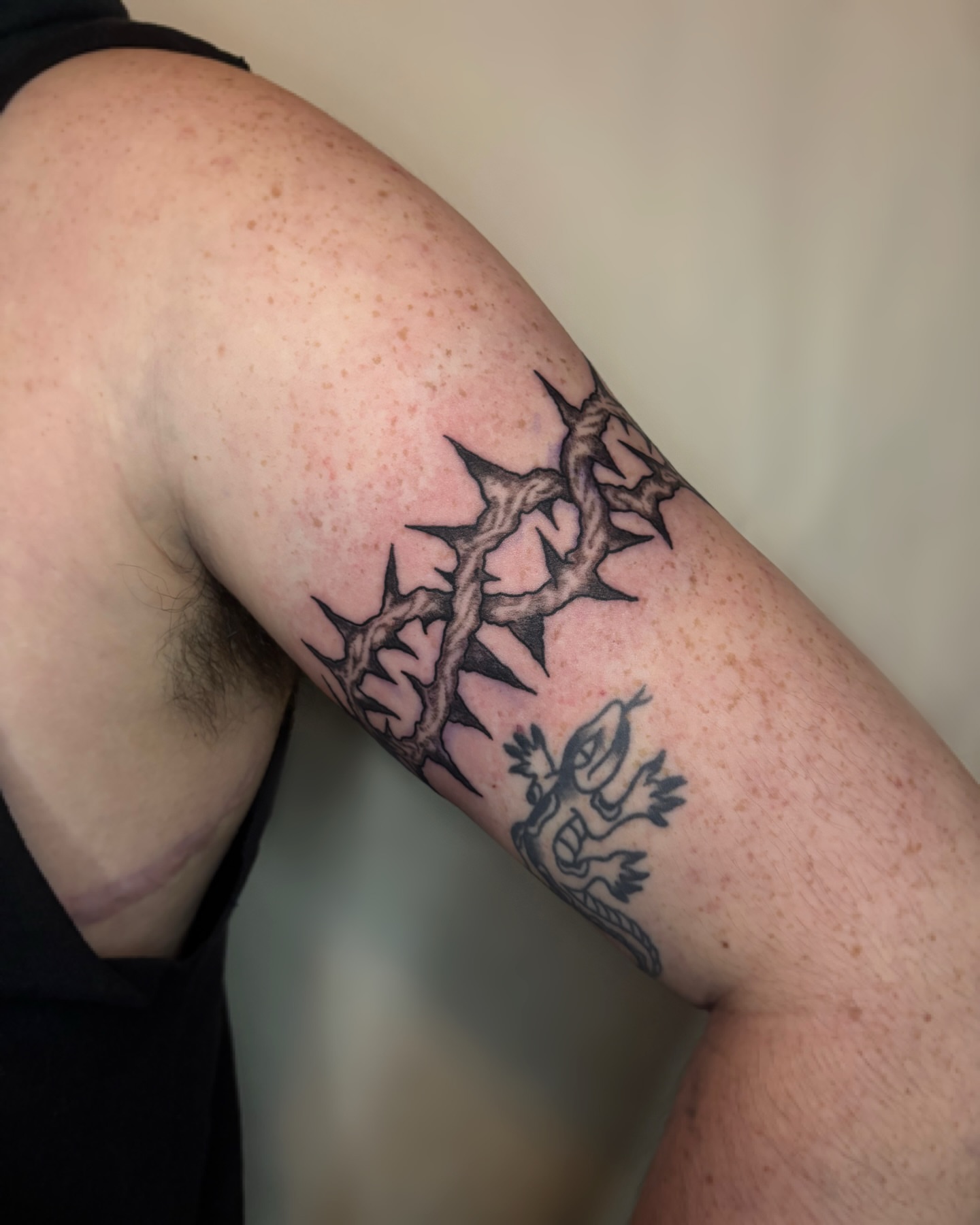 Crown of thorns black and grey tattoo on the forearm by Cooper, Portland, Oregon
