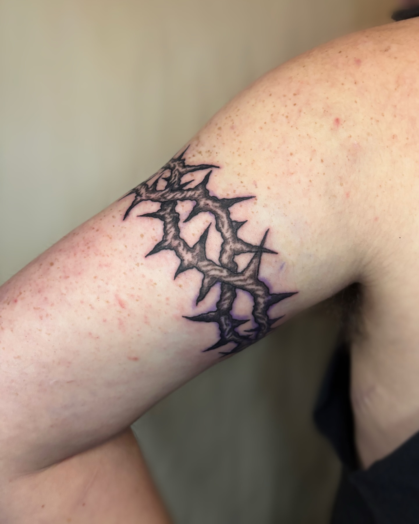 Thorn crown black and grey tattoo on the forearm by Cooper, Portland, Oregon