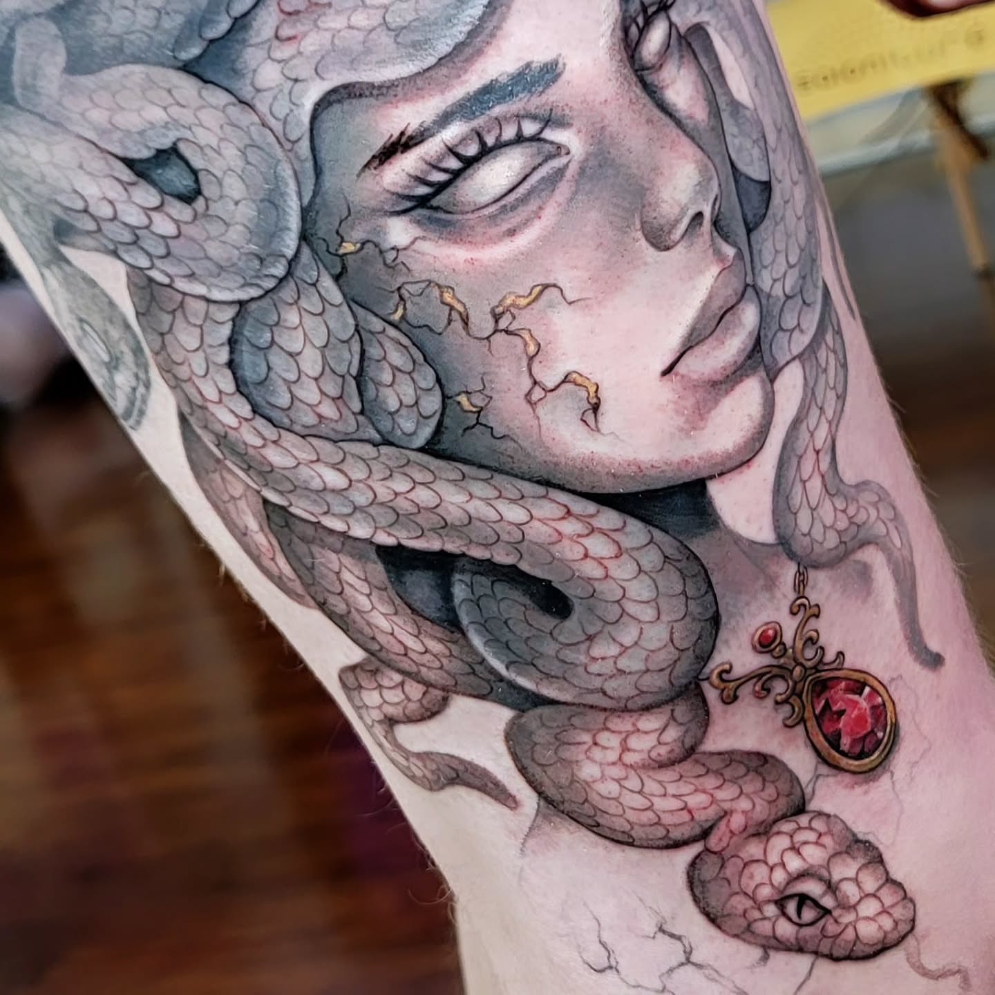 Woman with snakes realism tattoo on the forearm by Kerry Rose