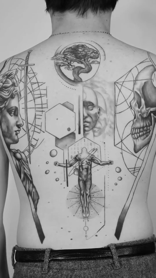 Vitruvian man and anatomical diagrams realism tattoo by Ross Clark Tattoos