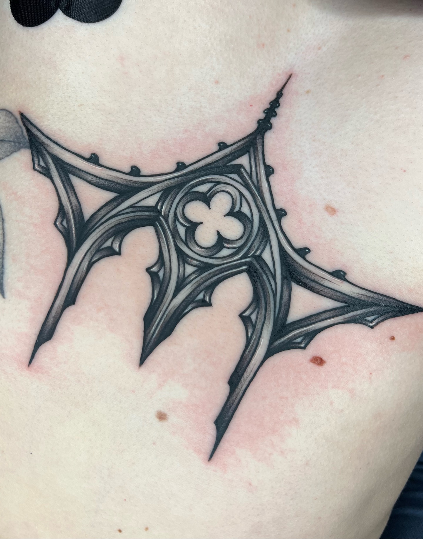 Gothic arch black and grey tattoo on the chest by 𝔐𝔦𝔠𝔥𝔢𝔩𝔩𝔢 ℭ𝔥𝔞𝔪𝔢𝔯𝔩𝔦𝔨