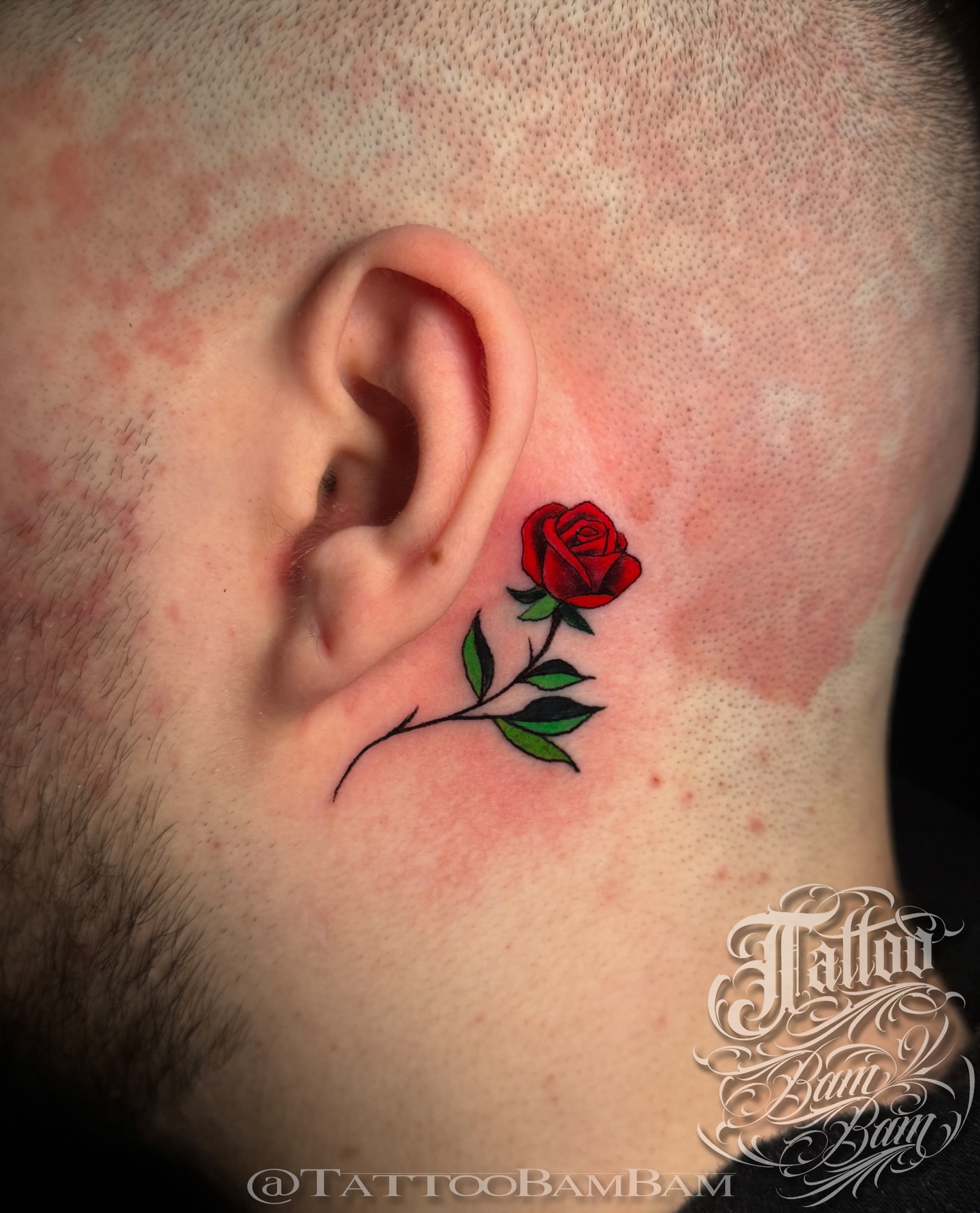 Red rose realism tattoo on the neck by Tattoo Bam Bam