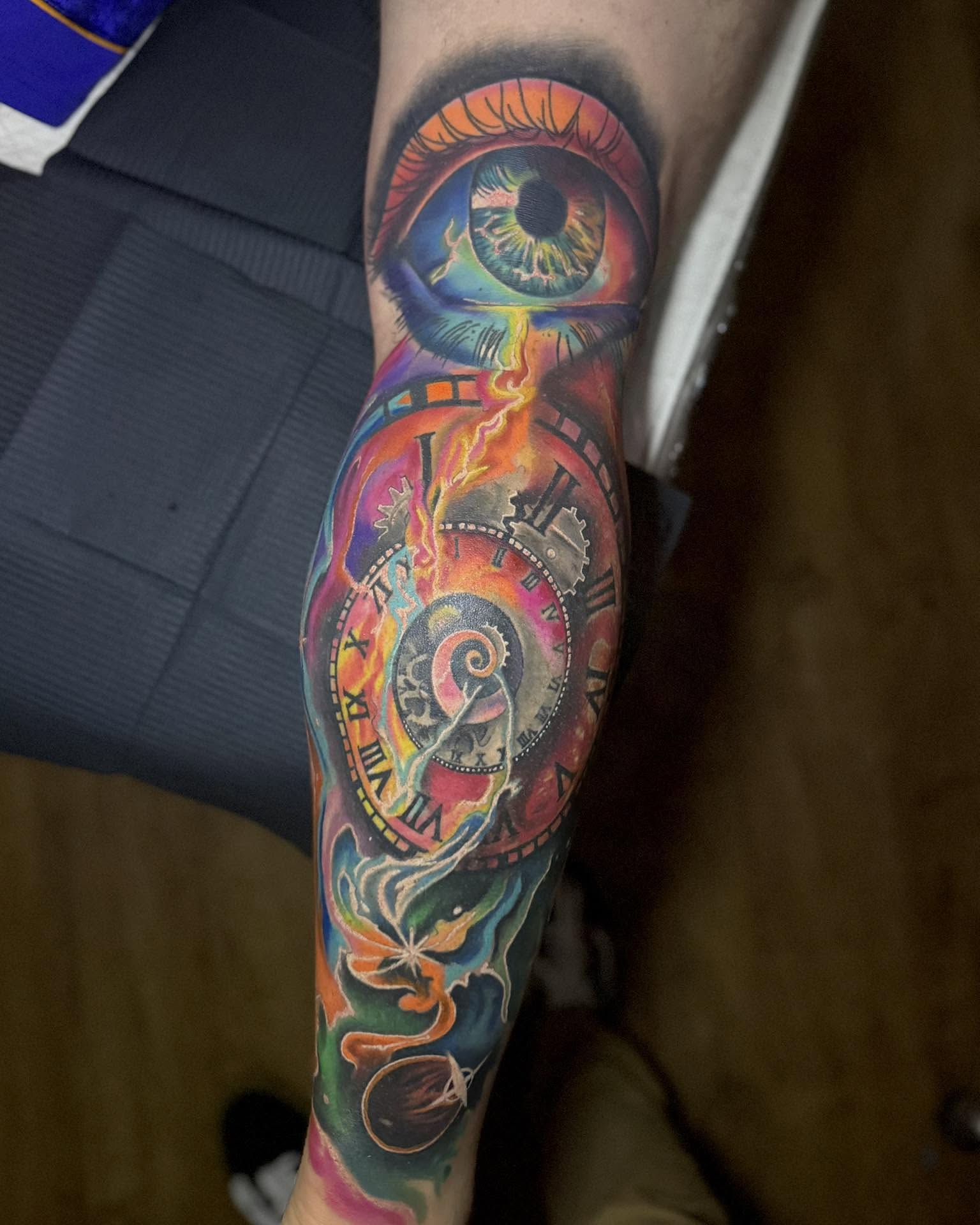 Eye and clock surrealism tattoo on the forearm by Corey Bailey, Stanton, Kentucky
