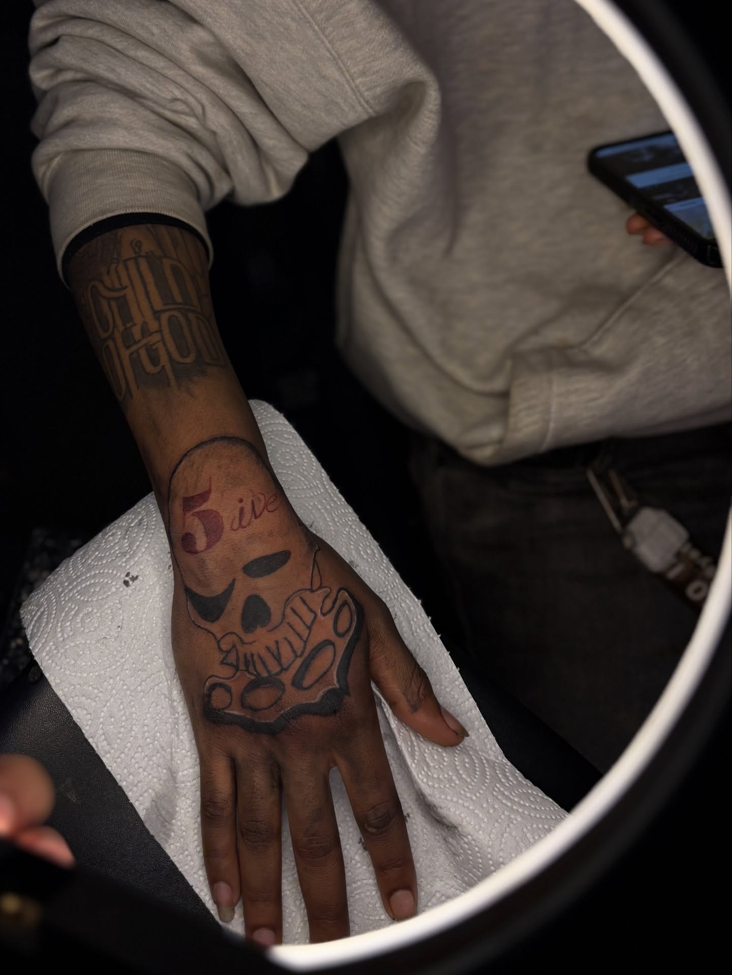 Skull American traditional tattoo on the hand by Winter j