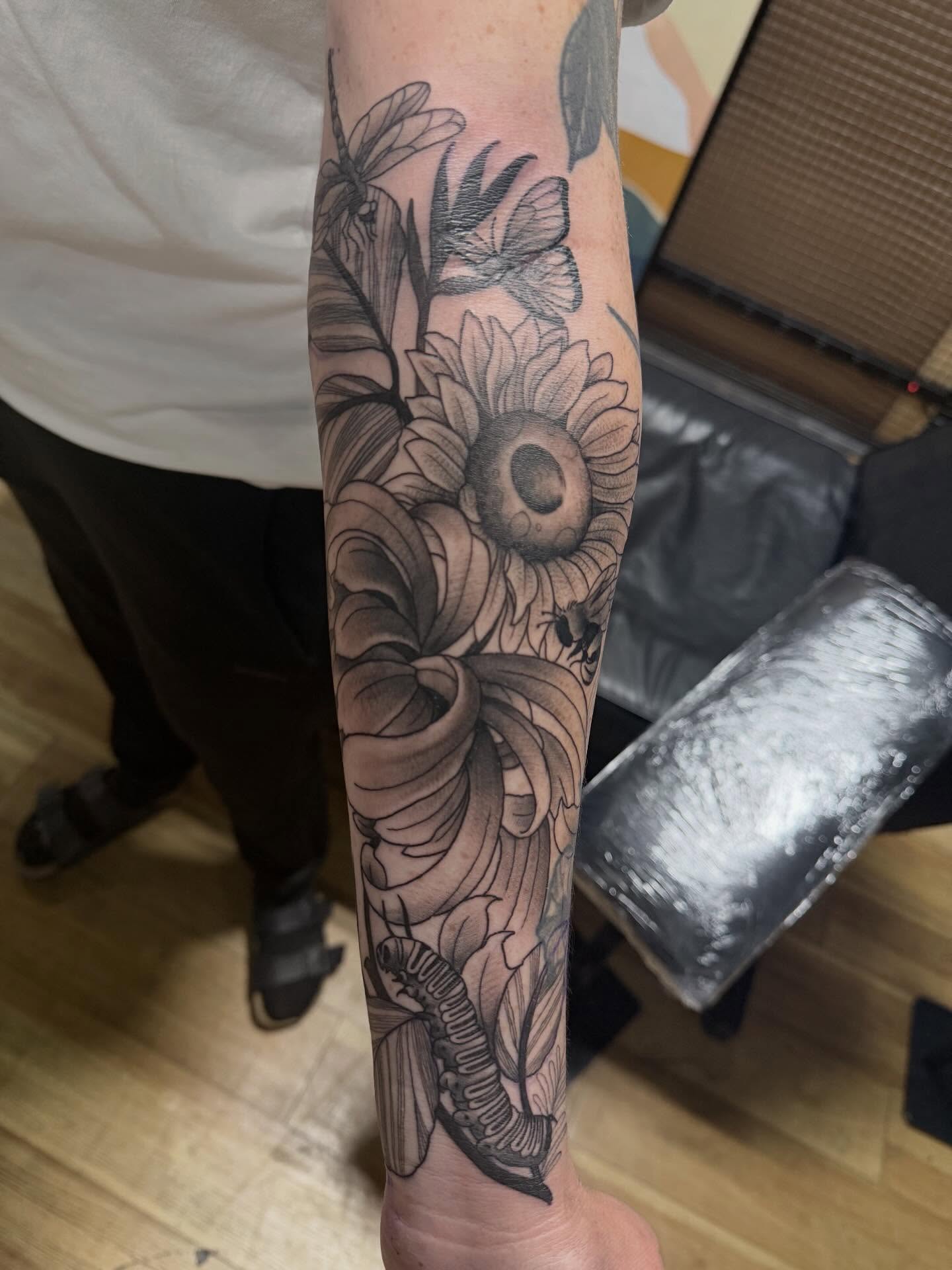 Sunflower bouquet realism tattoo on the forearm by H.G