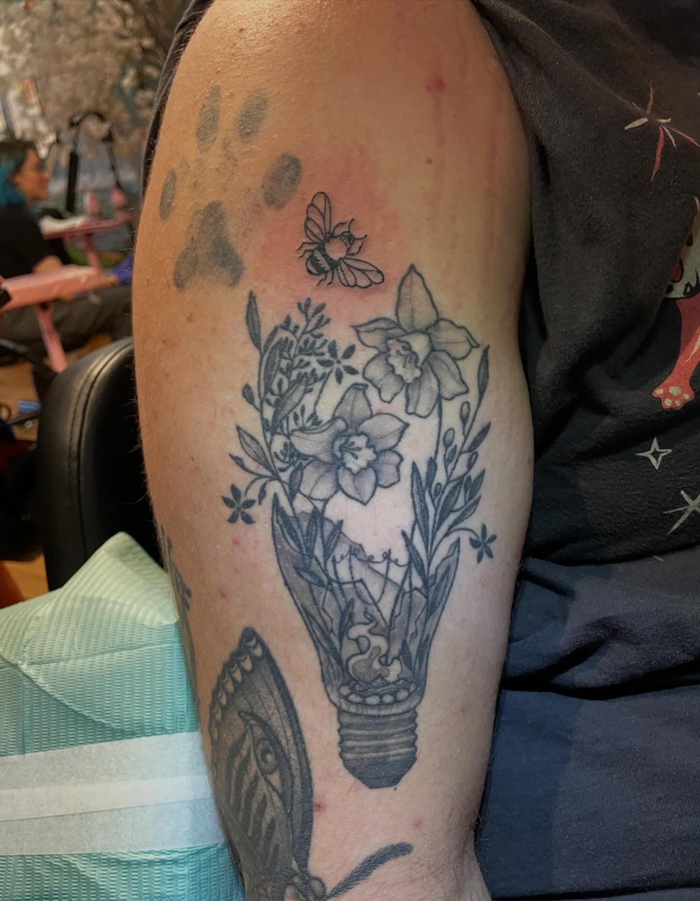 Light bulb with flowers black and grey tattoo on the forearm by Lake Stephens, Richmond, Virginia