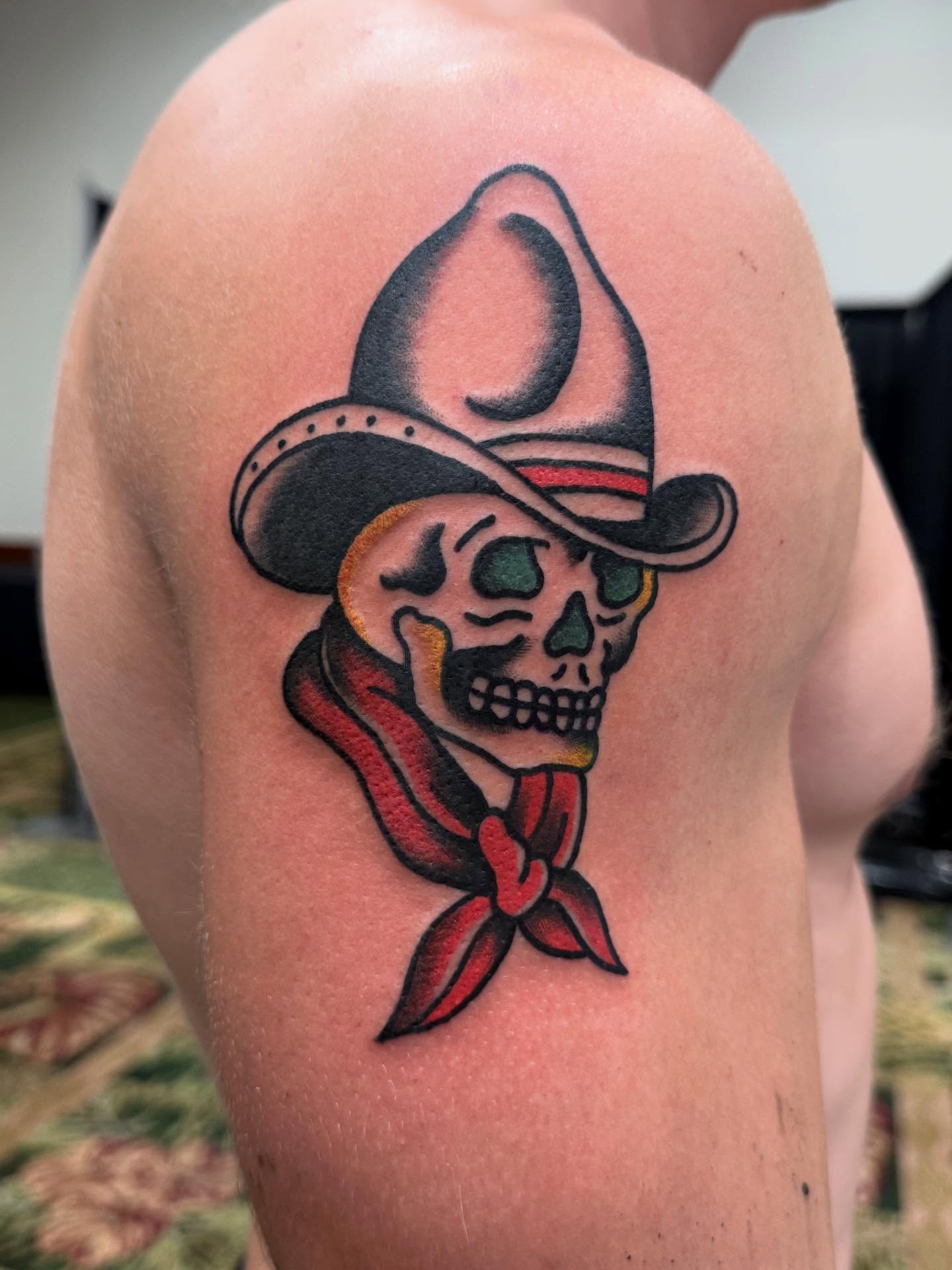 Cowboy skull American traditional tattoo on the shoulder by Jesse Coldiron