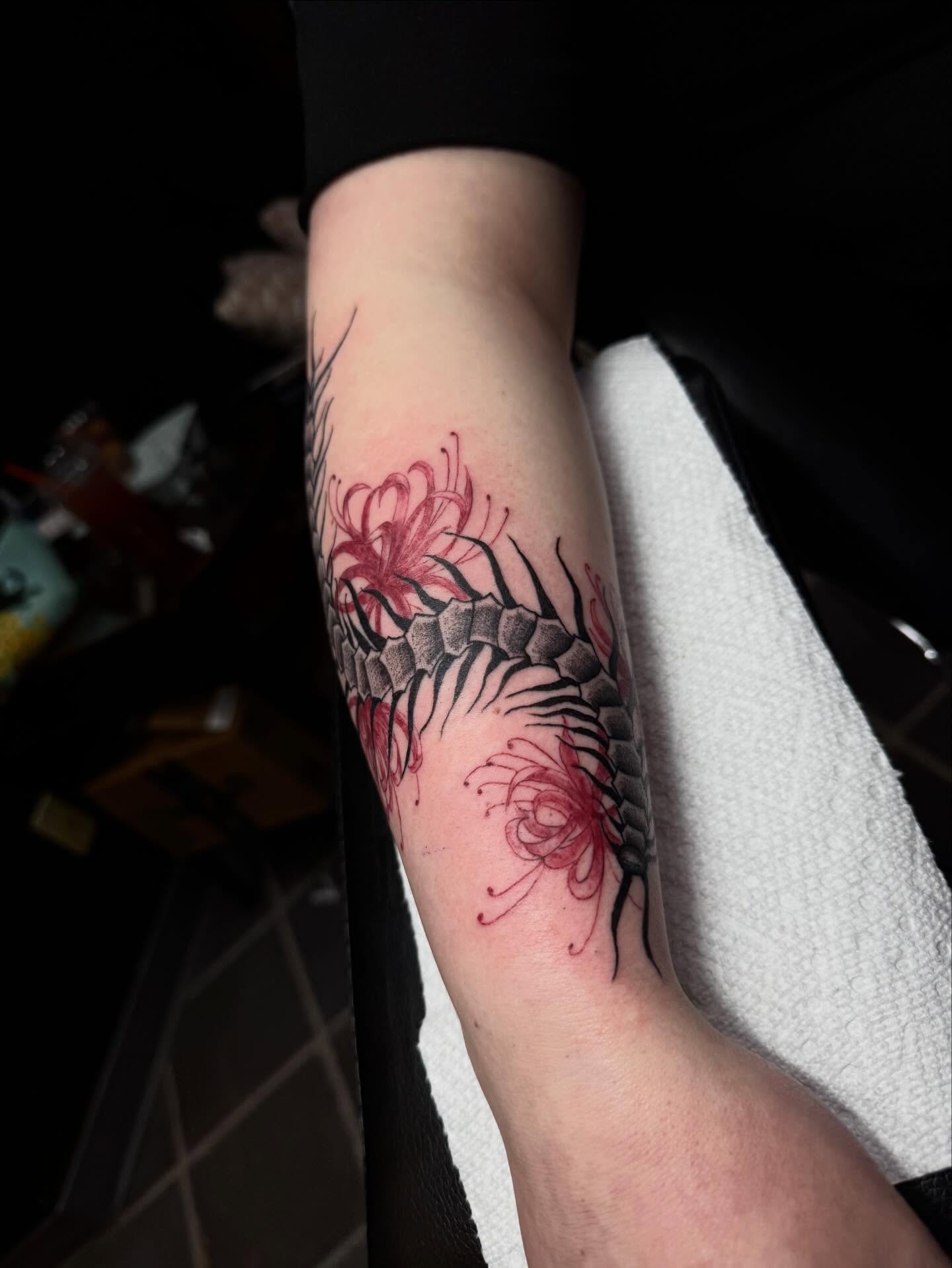 Chrysanthemum and dragon scales realism tattoo on the forearm by olivia reed