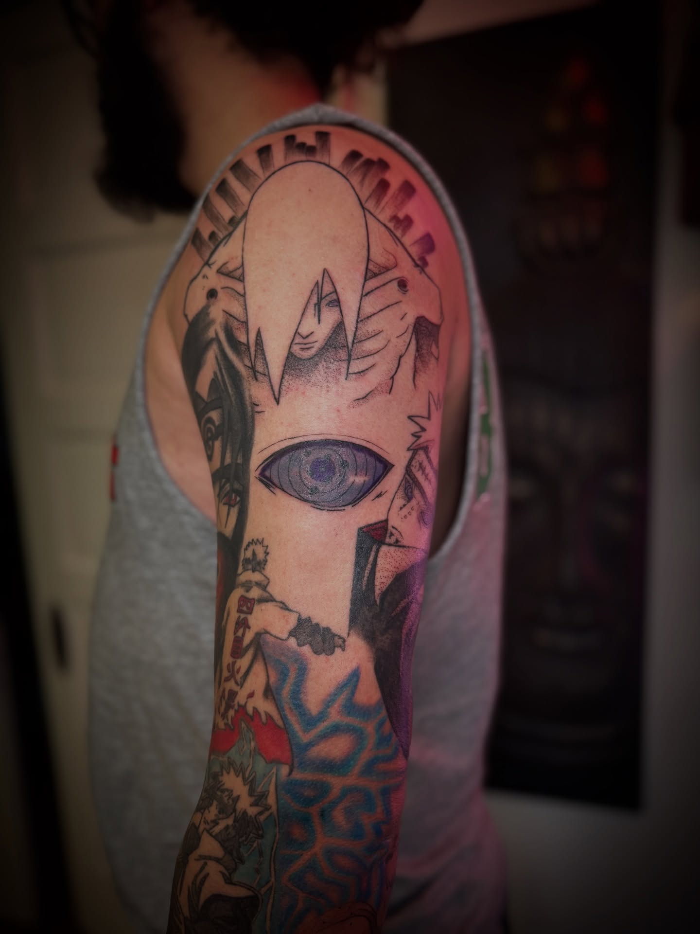 Anime character anime tattoo on the upper arm by Gianna G