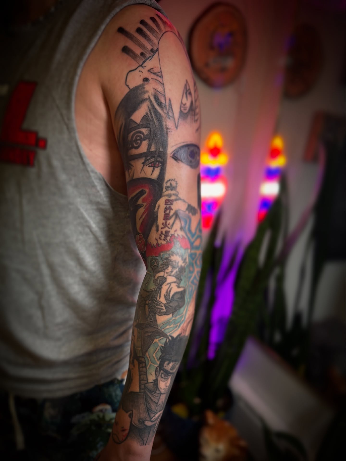 Anime characters anime tattoo on the upper arm by Gianna G