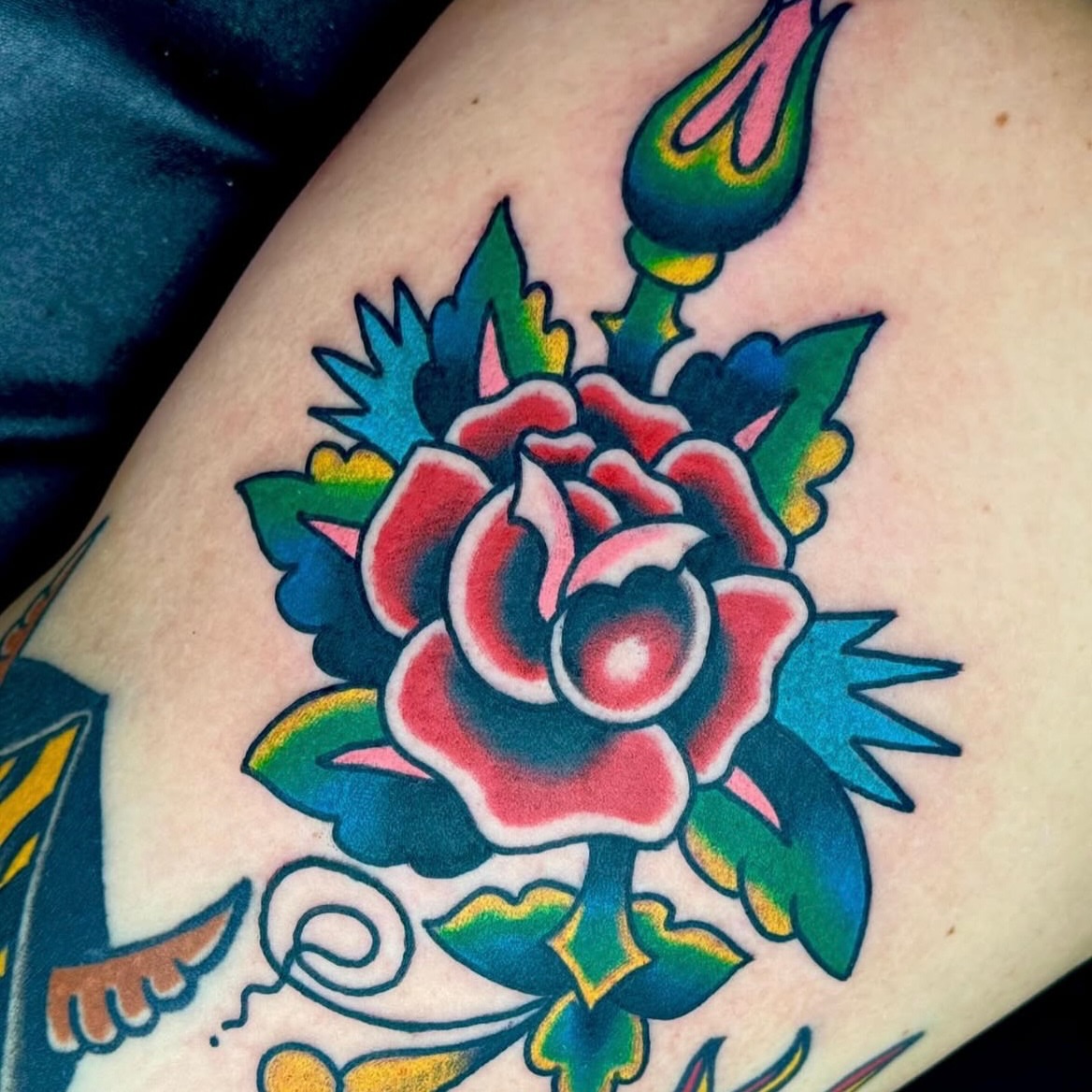 Rose American traditional tattoo on the thigh by Sam Hambrick, Watchung NJ