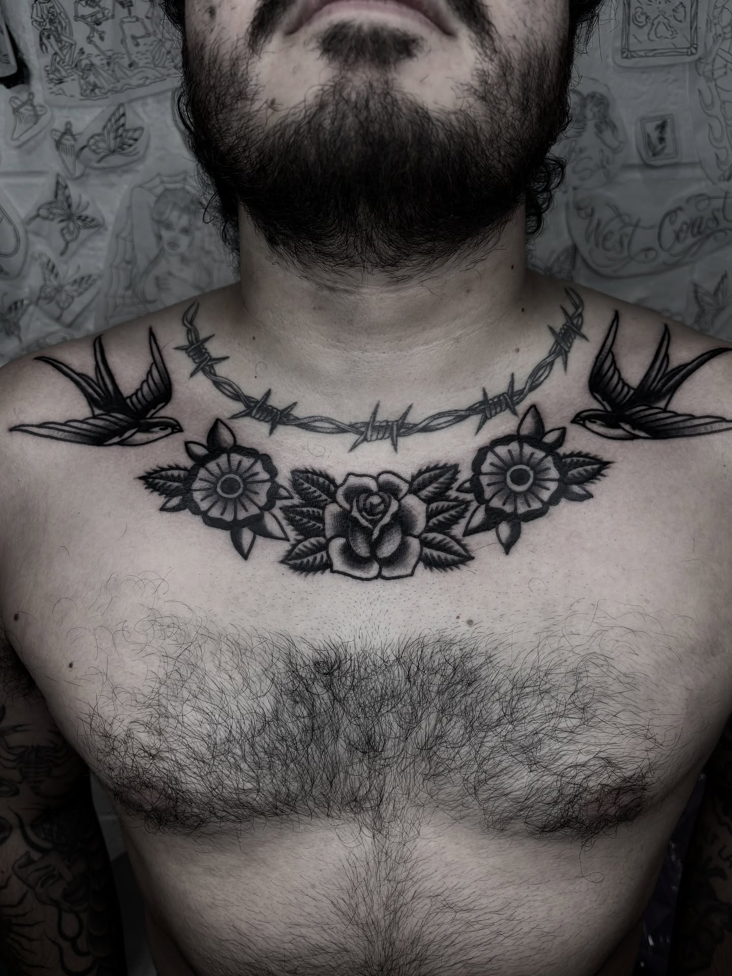 Barbed wire and flowers American traditional tattoo on the chest by π³πππ πΆπππππ