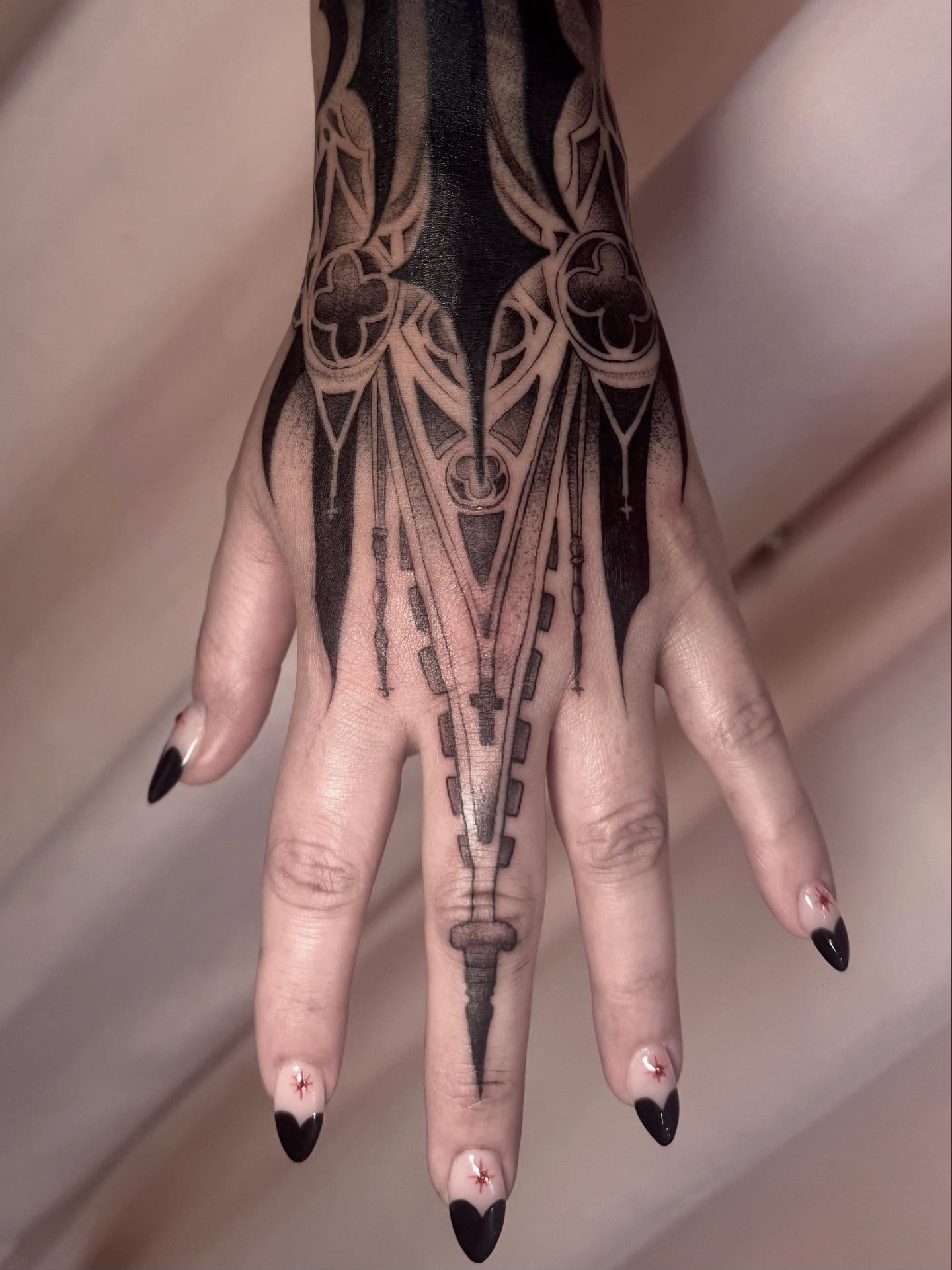 Geometric design geometric tattoo on the hand by Claire Litsey