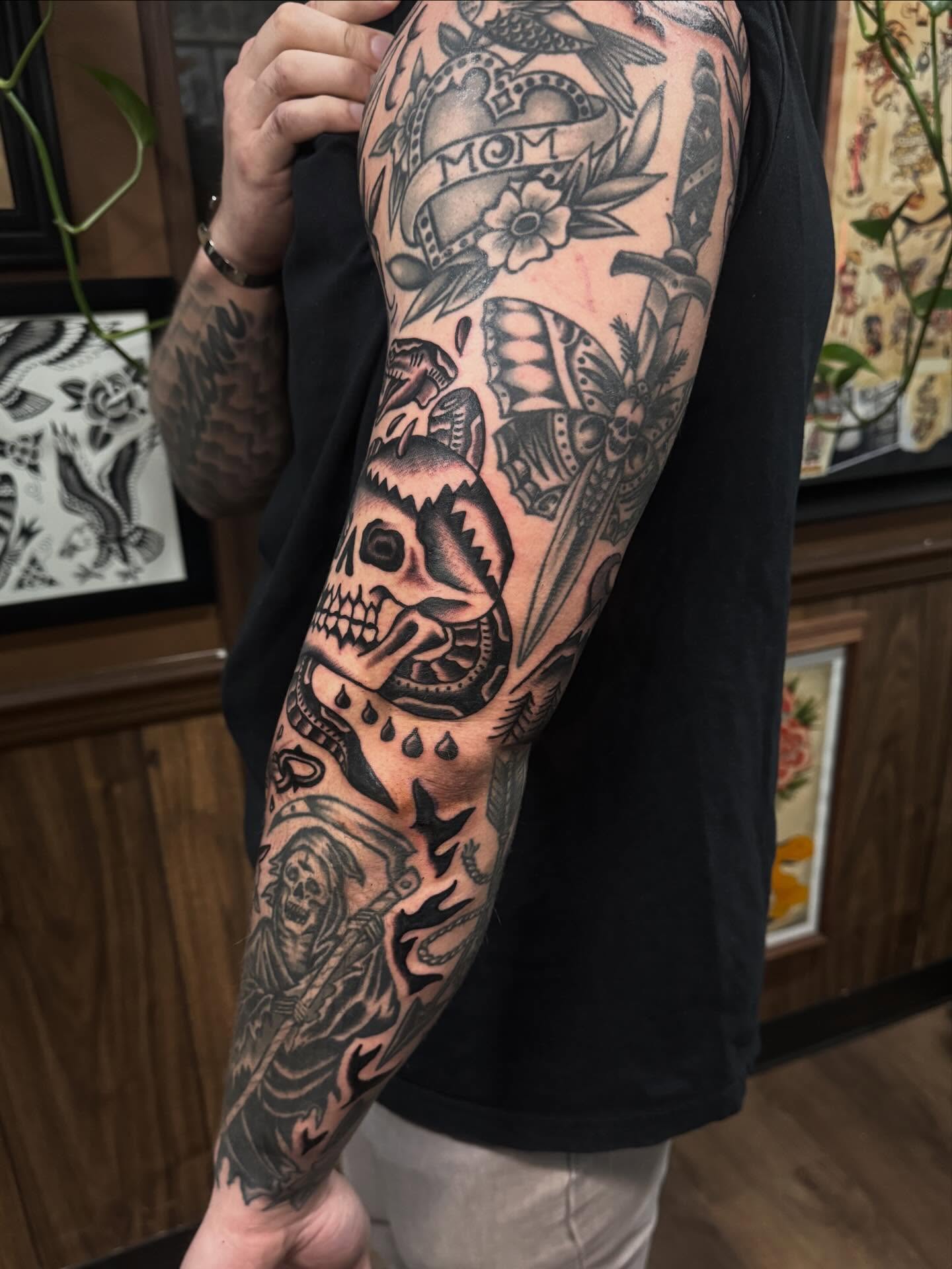 Skull and grim reaper American traditional tattoo on the forearm by Ryan Engels