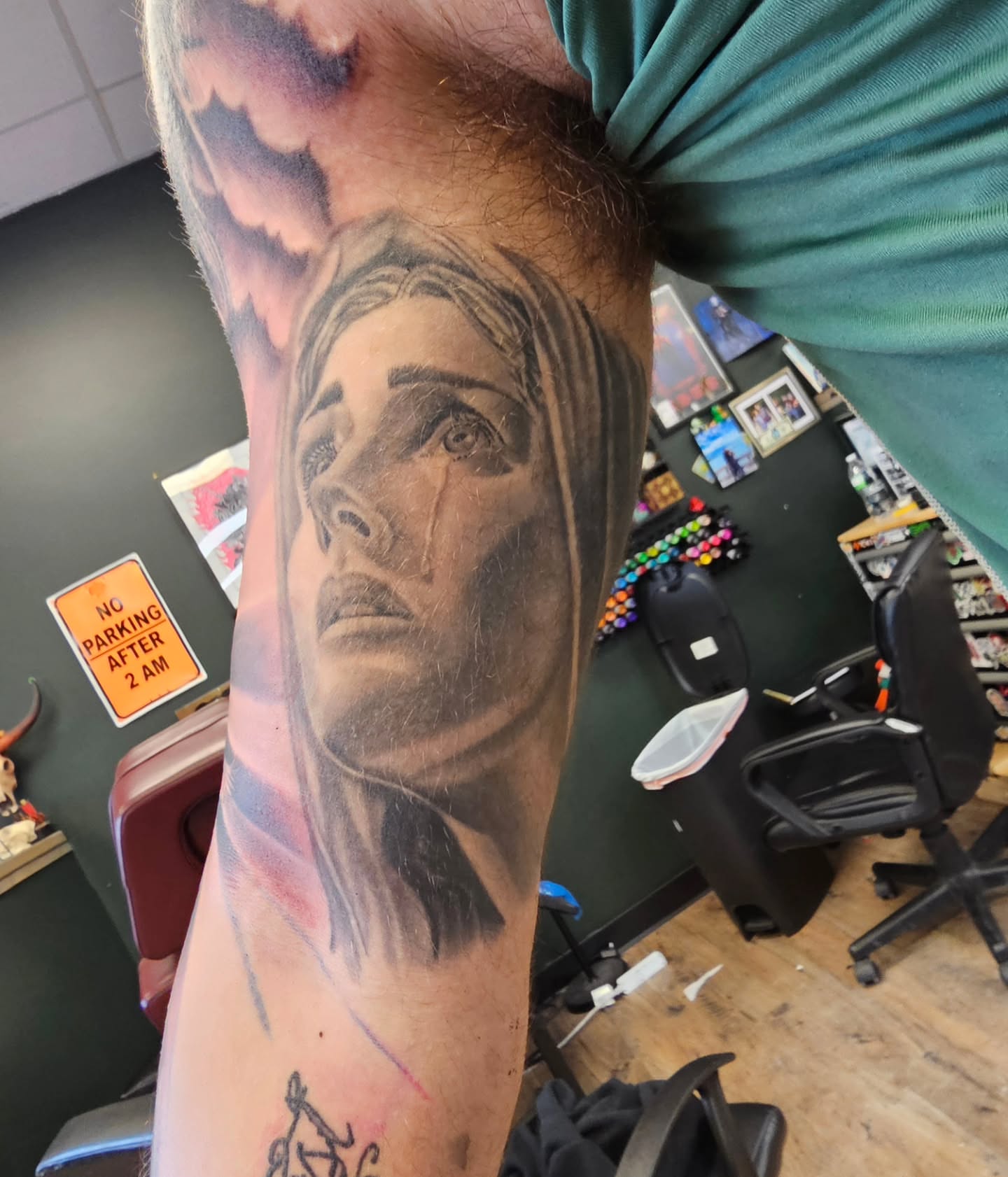 Portrait realism tattoo on the forearm by Derek Davis
