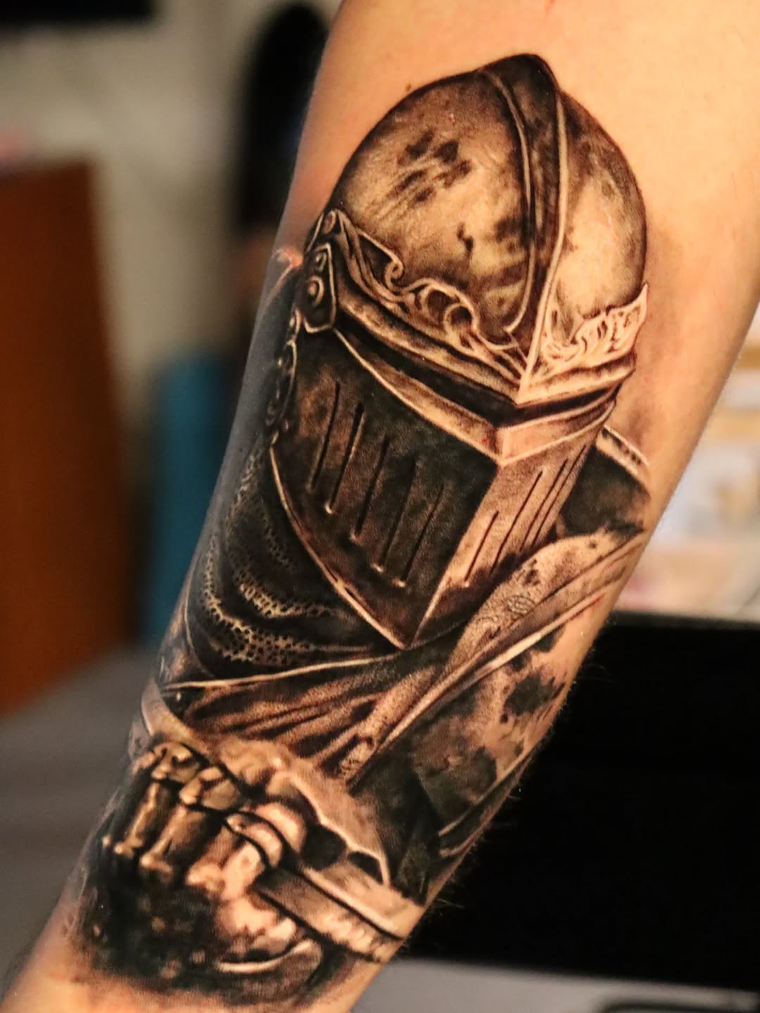 Knight's helmet realism tattoo on the forearm by Miami Florida Tattoo Artist