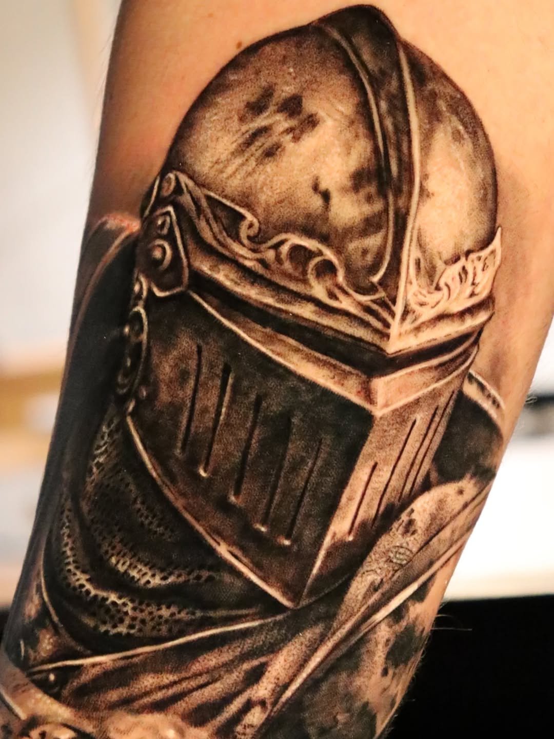 Knight's helmet realism tattoo on the forearm by Miami Florida Tattoo Artist
