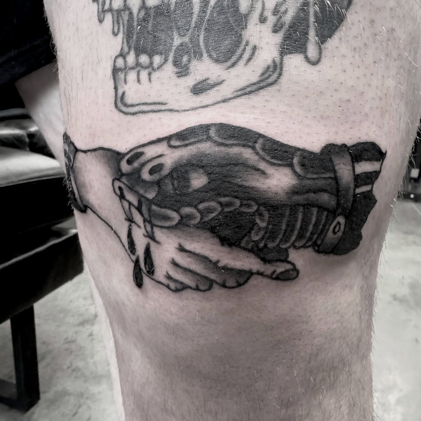 Mechanical gear black and grey tattoo on the leg by Seth Christianson