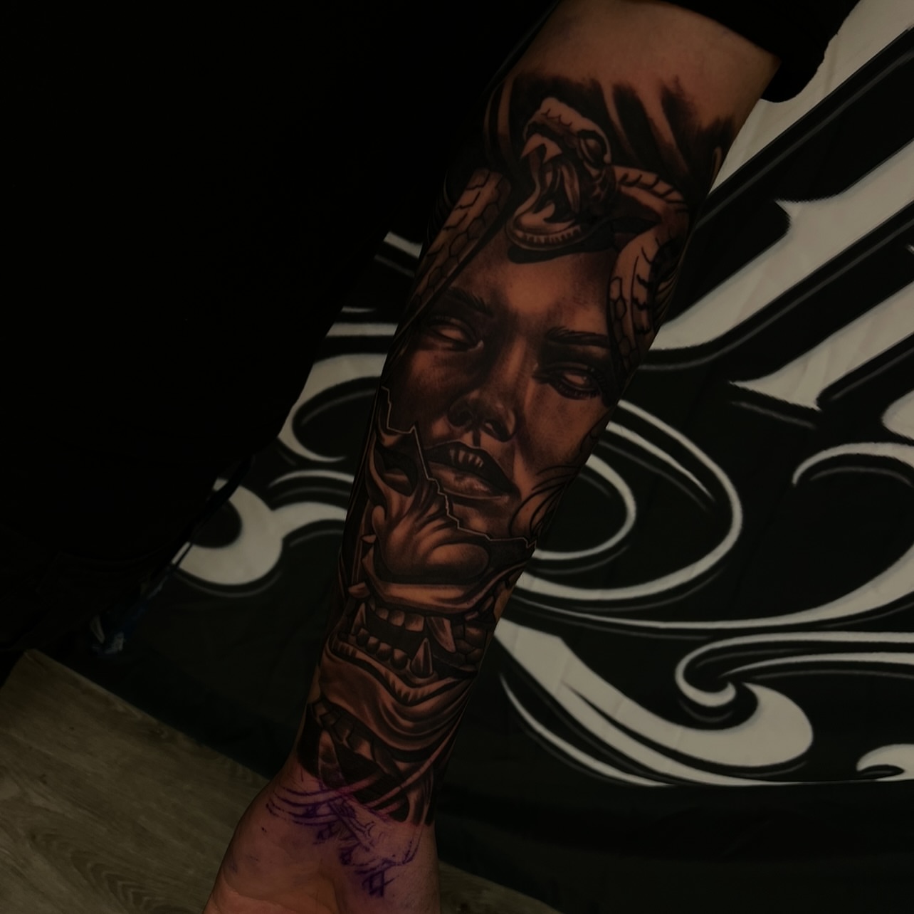 Woman's face realism tattoo on the forearm by Daniel Michael Perez