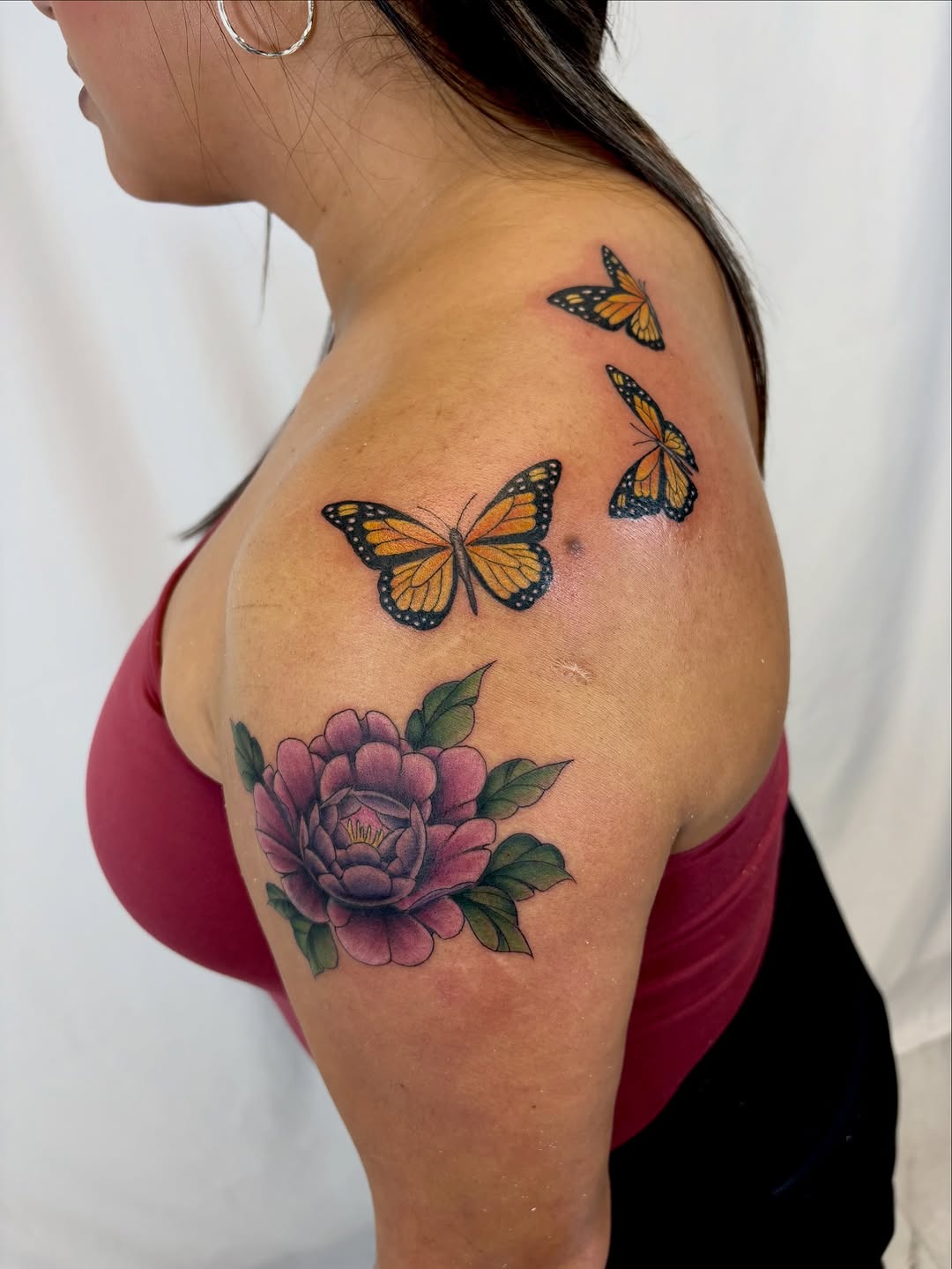 Peony and monarch butterflies neo-traditional tattoo on the shoulder by Bianca Cattapan