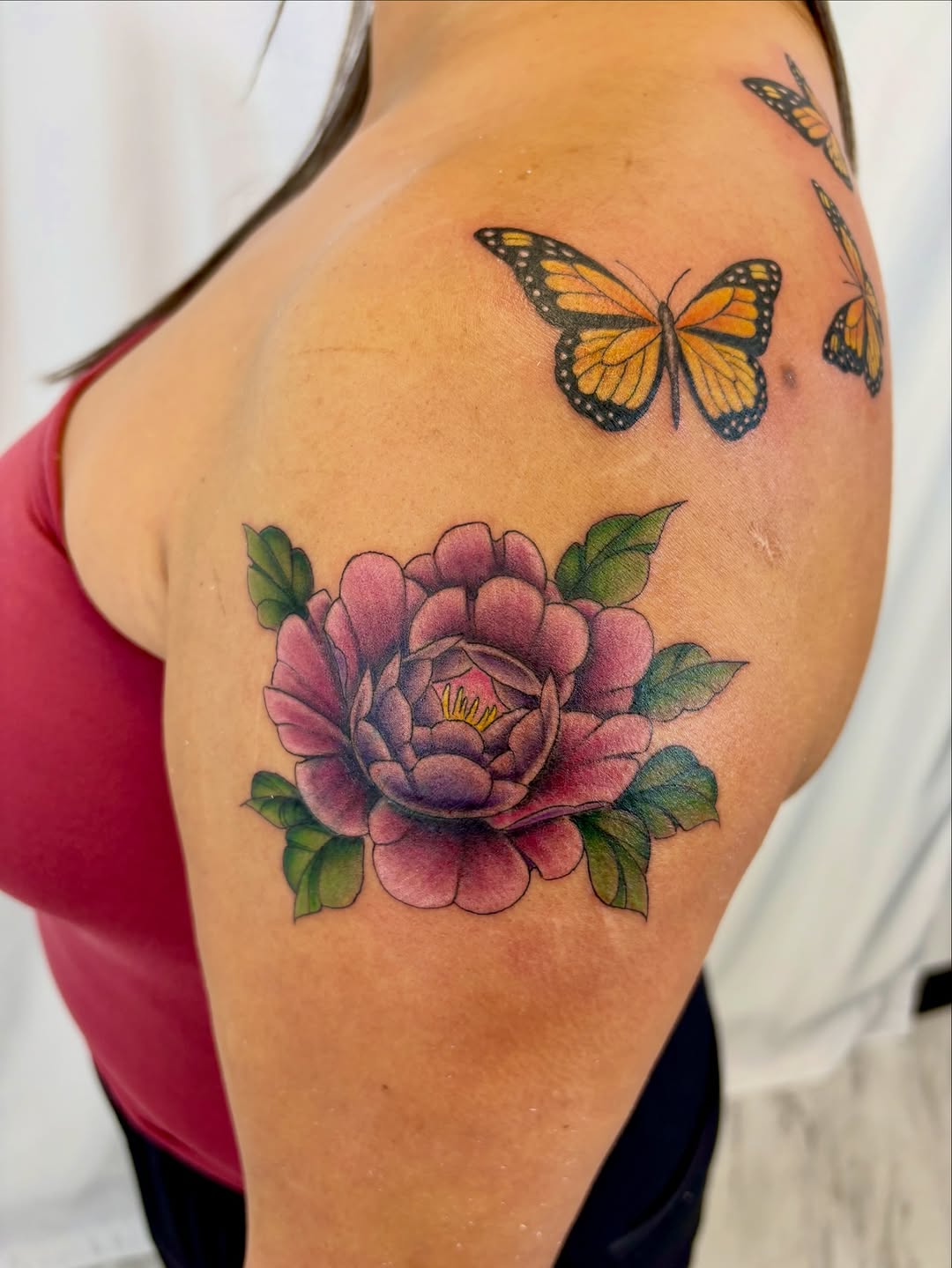 Peony and monarch butterflies neo-traditional tattoo on the shoulder by Bianca Cattapan