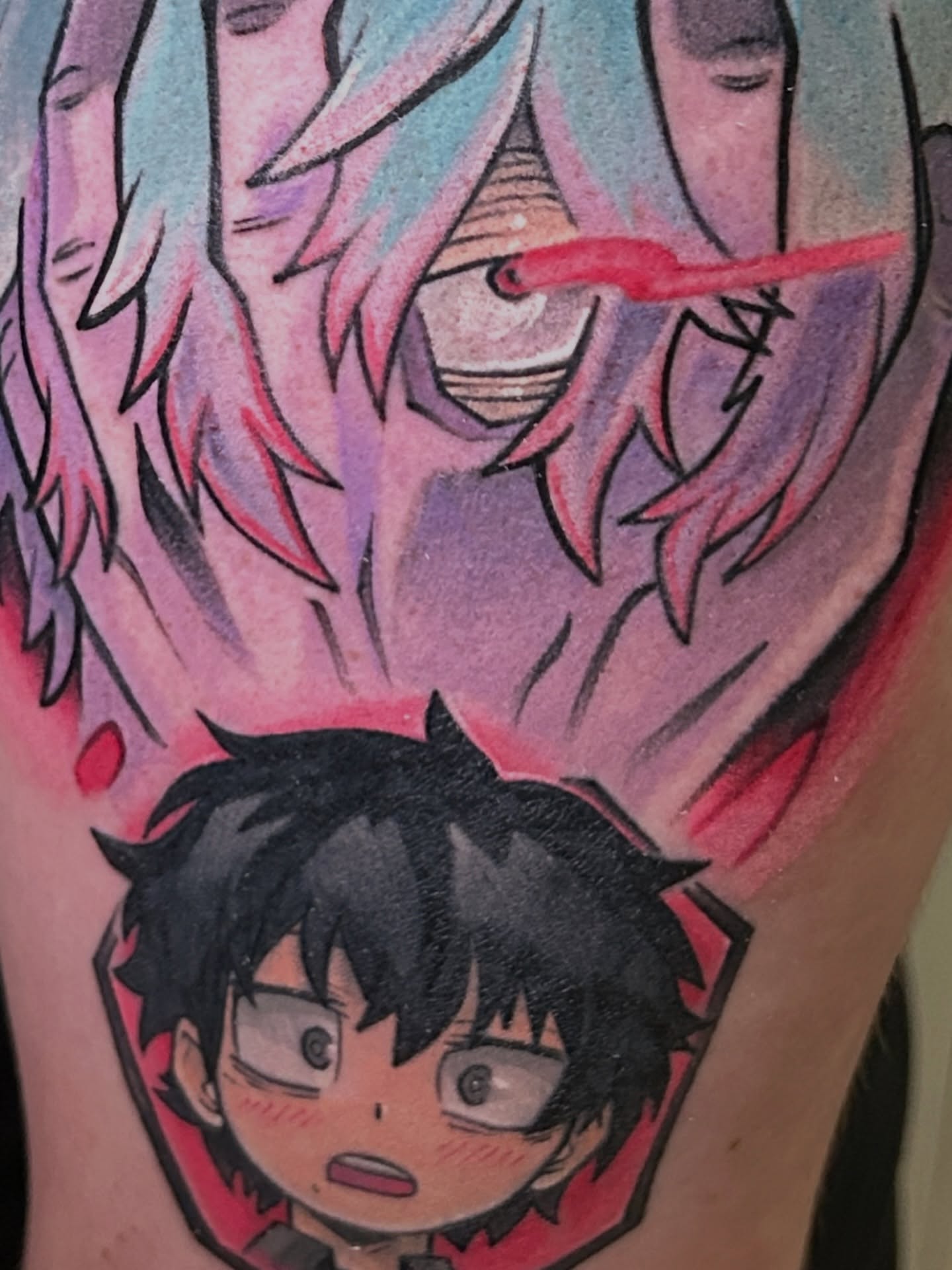 Anime characters anime tattoo on the upper arm by Mando Castro