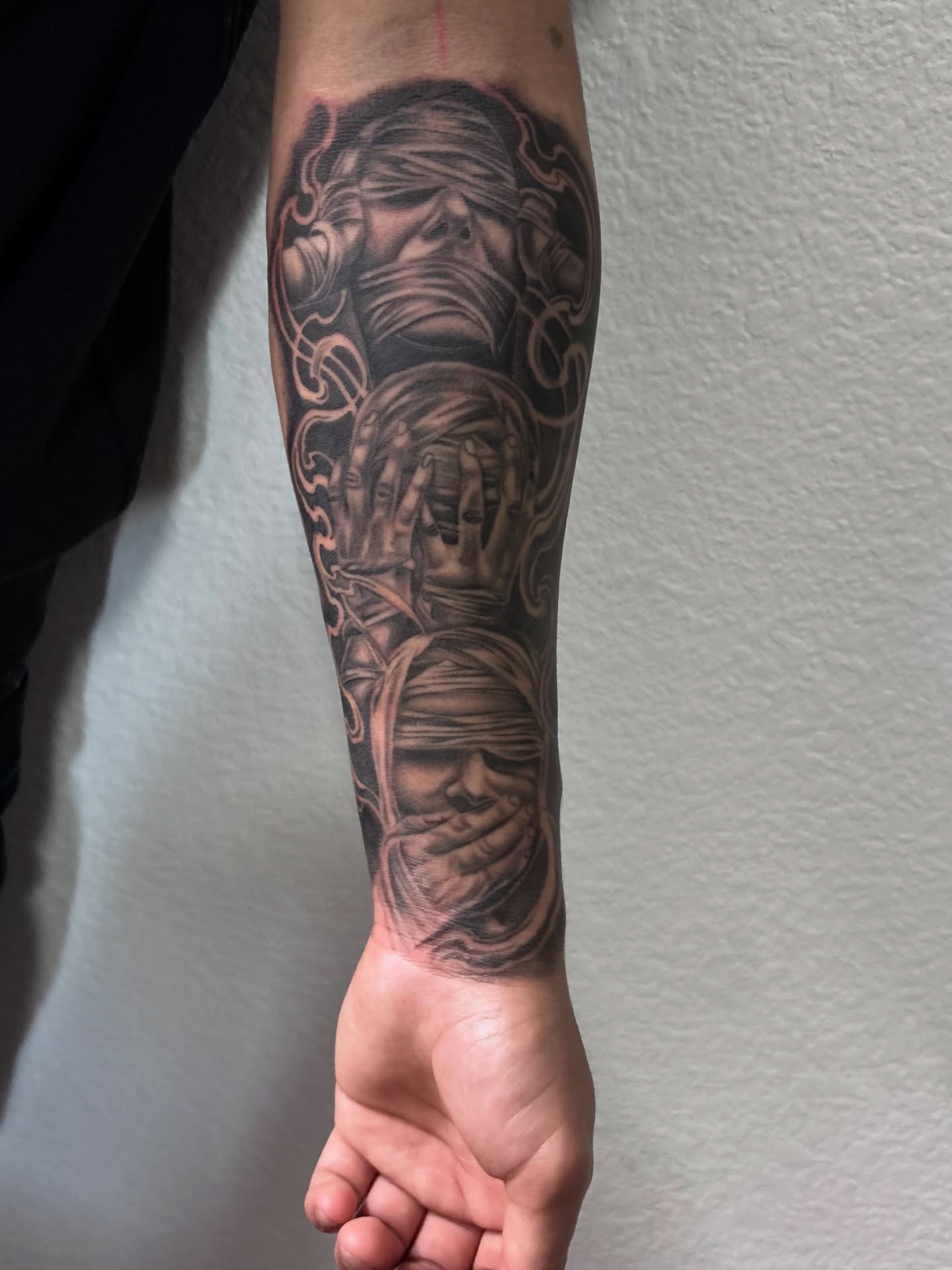 Three faces realism tattoo on the forearm by @tattoosbyadrian