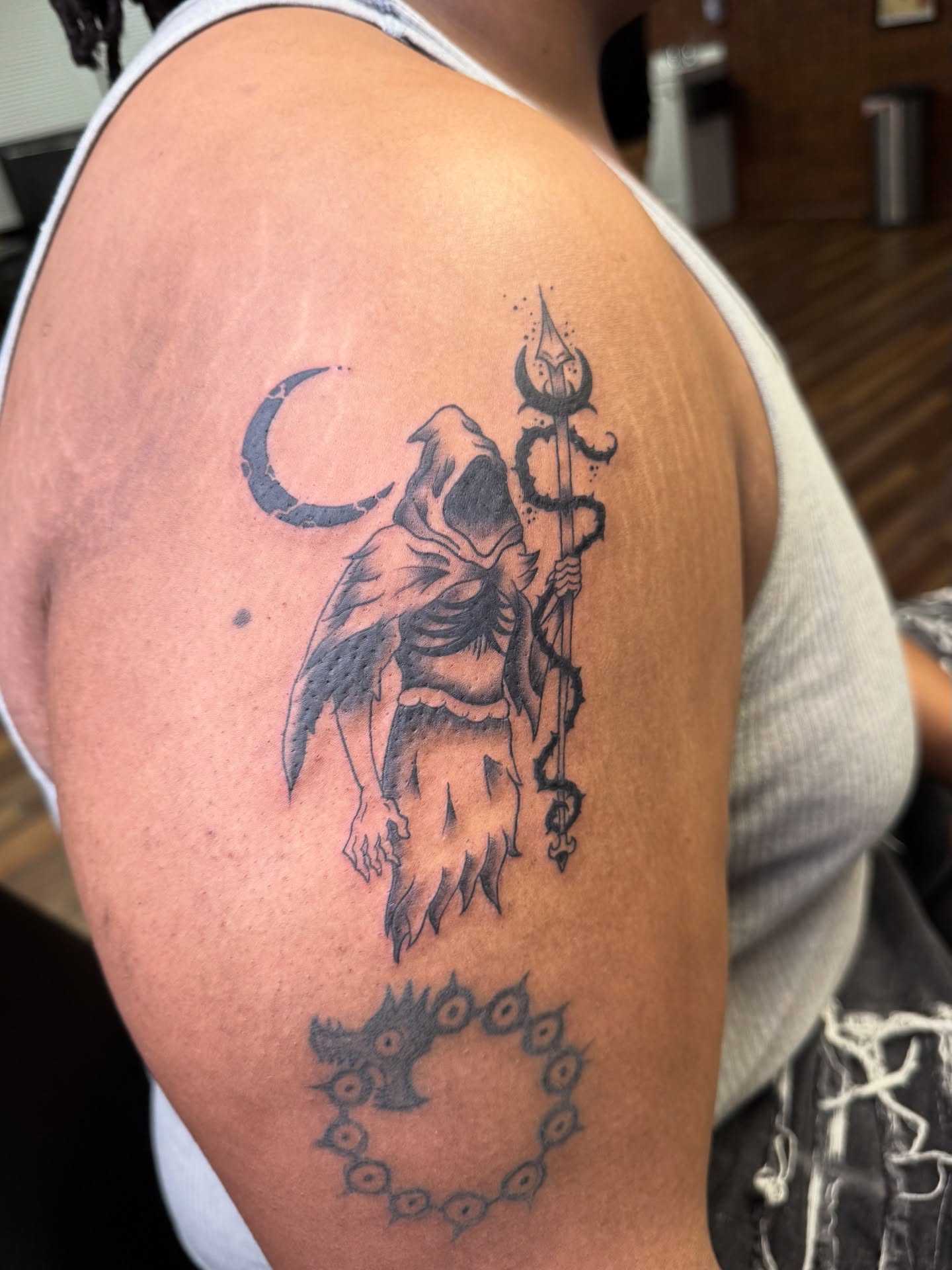 Reaper with trident black and grey tattoo on the shoulder by Palmer Andrist🩸Fort Collins Tattoo Apprentice