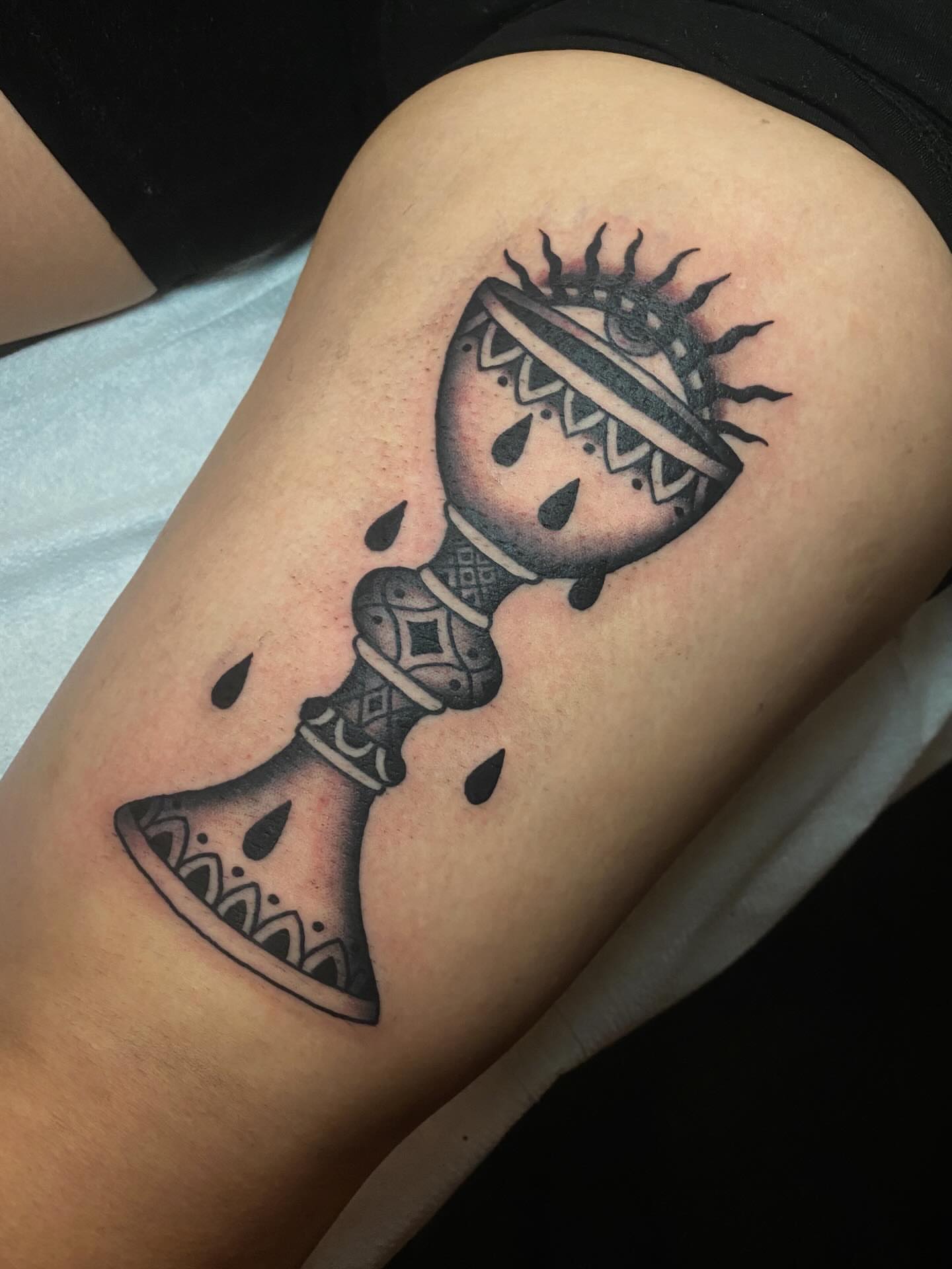 Hourglass black and grey tattoo on the thigh by Jaclin Grace Hastings