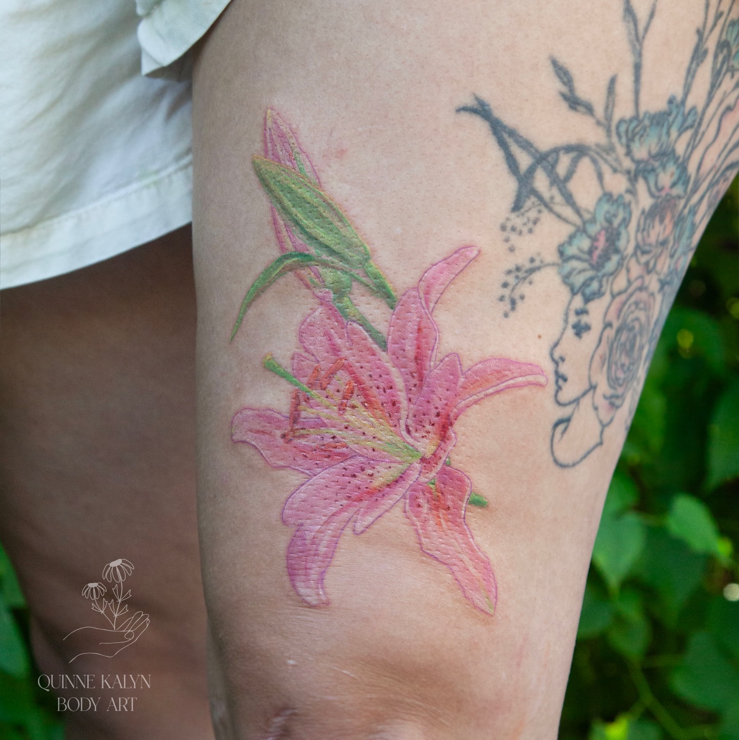 Lily realism tattoo on the thigh by Nashville Piercer & Tattoo Artist ✨ Quinne