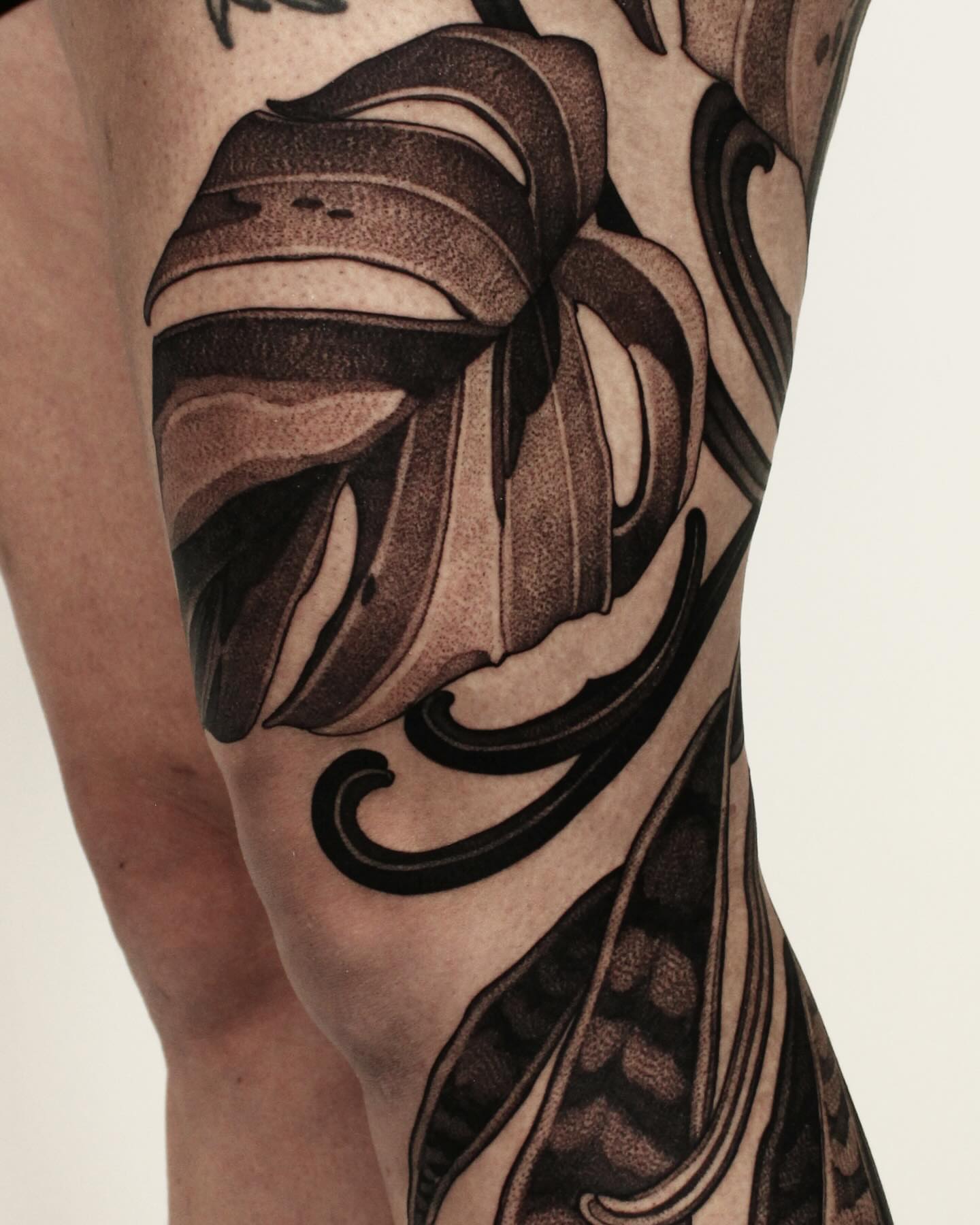 Monstera leaf black and grey tattoo on the forearm by Heather Apgar