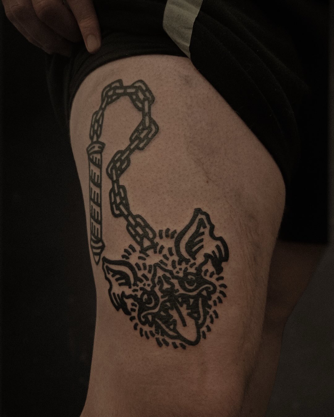 Cat and chain black and grey tattoo on the thigh by ashley blyght