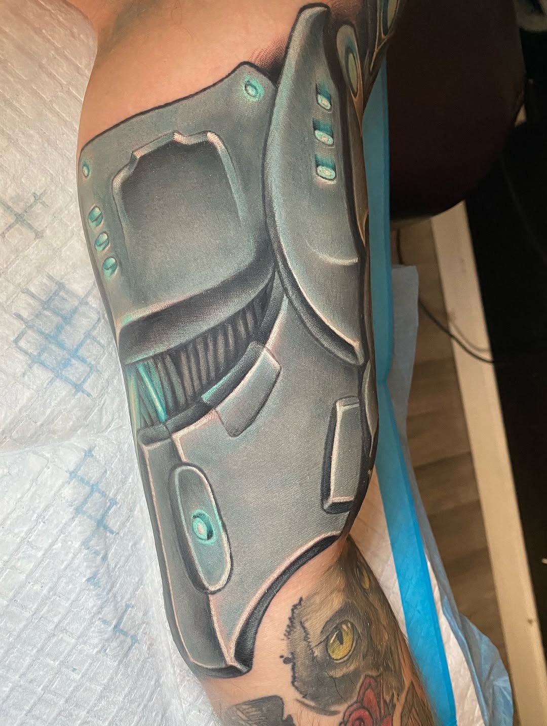 Robotic armor biomech tattoo on the forearm by Tattertot