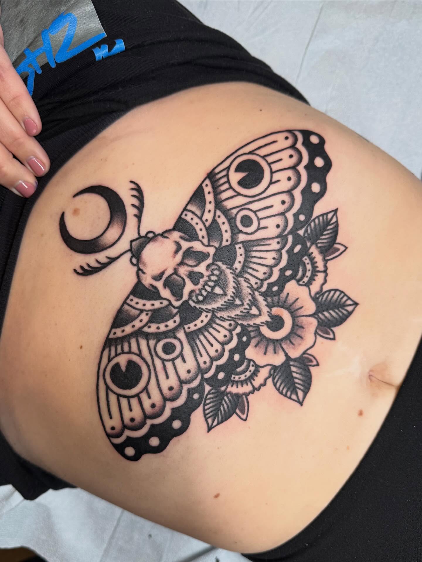 Moth skull and flower ornamental tattoo by Bill Crawford, Plymouth, Michigan