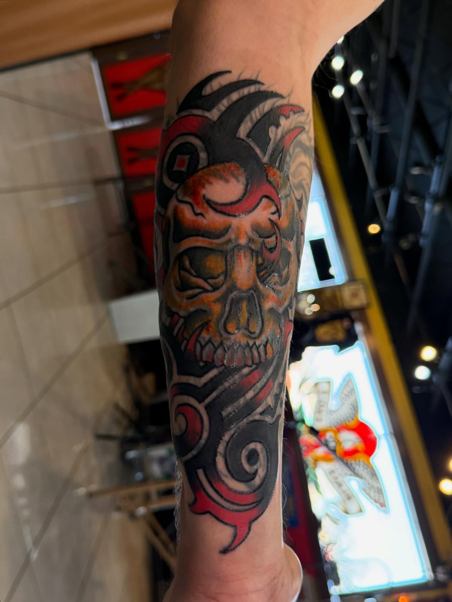 Skull japanese irezumi tattoo on the forearm by Bill Crawford, Plymouth, Michigan