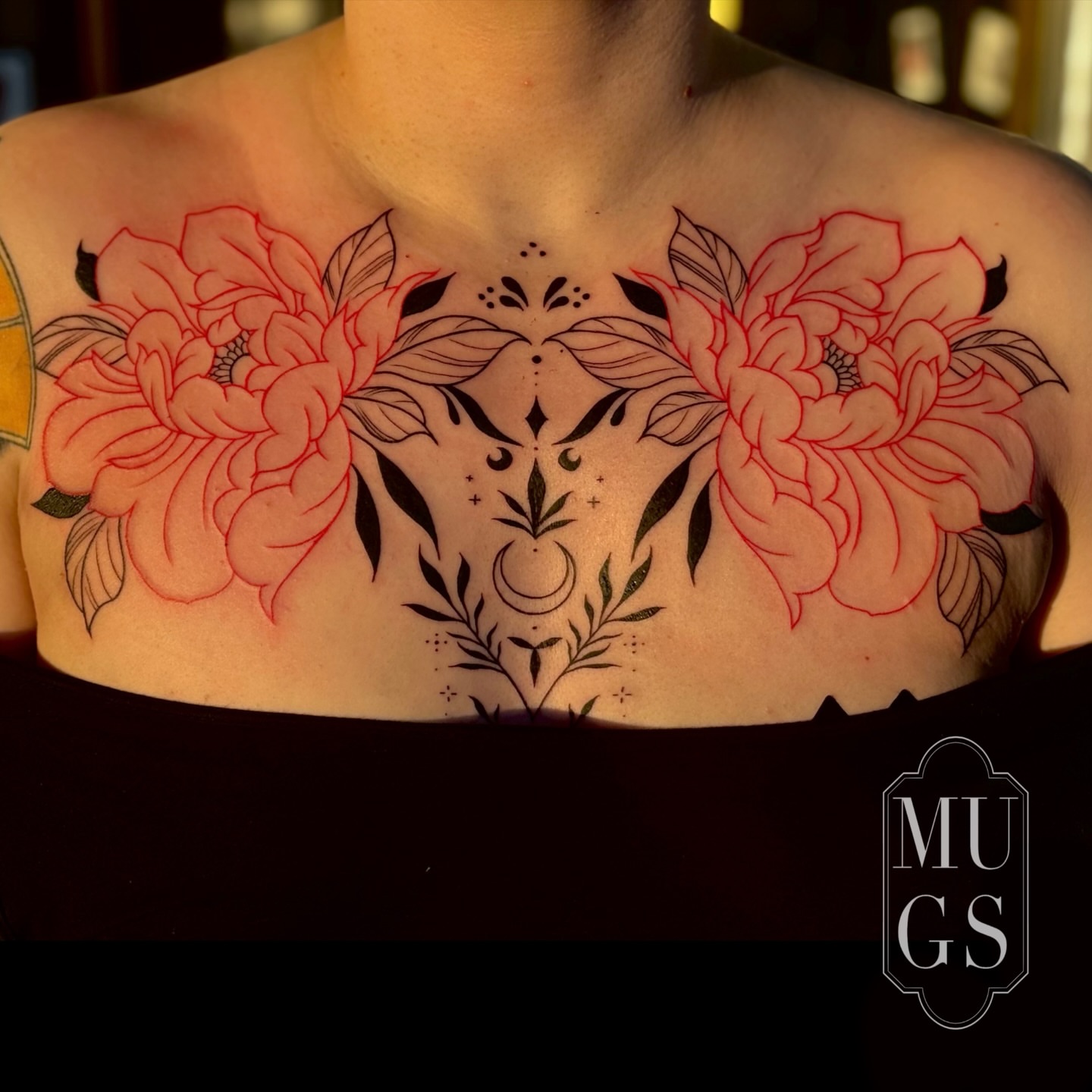 Floral arrangement neo-traditional tattoo on the chest by Emily Andreozzi