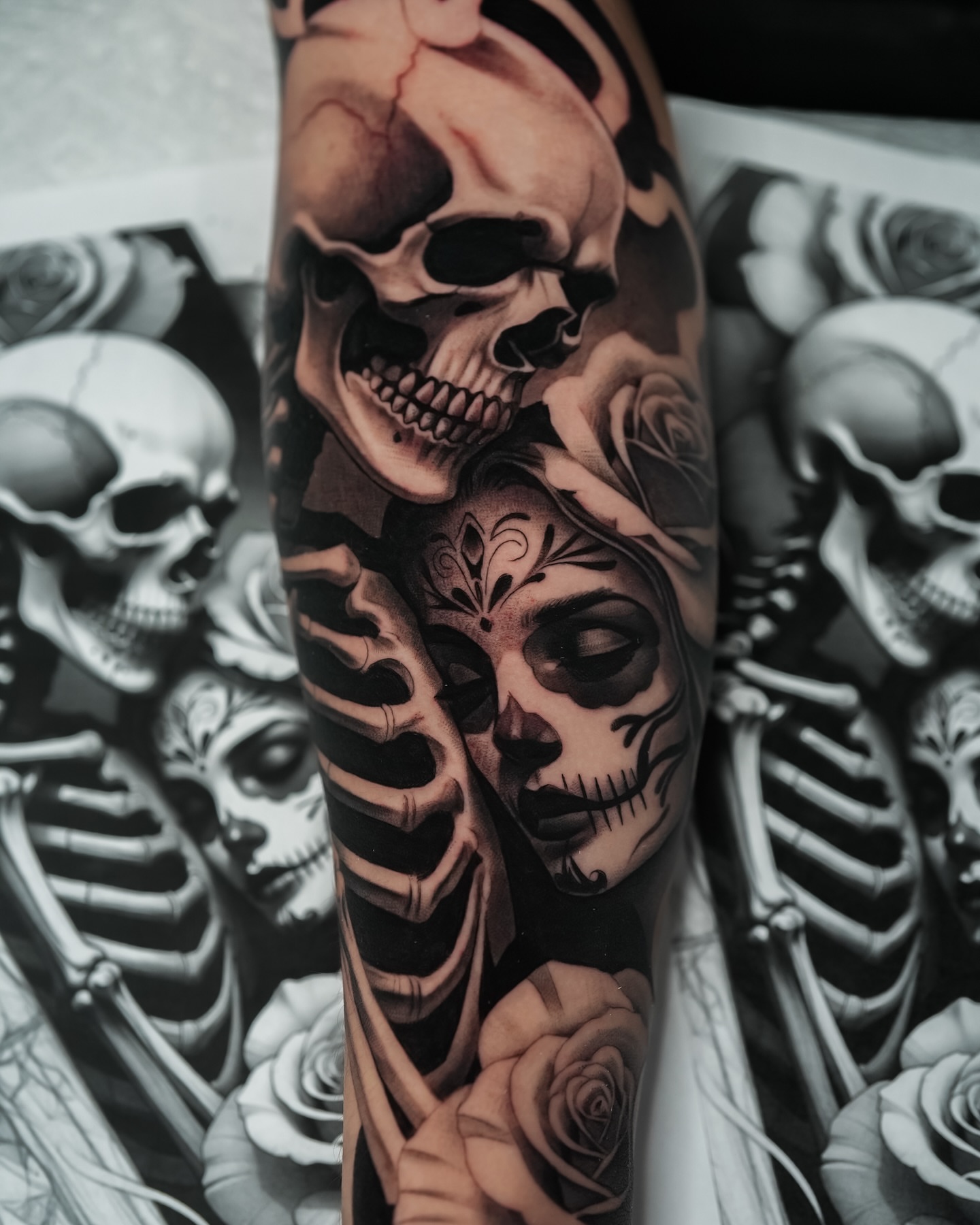 Sugar skull and roses realism tattoo on the forearm by Javier Chavez
