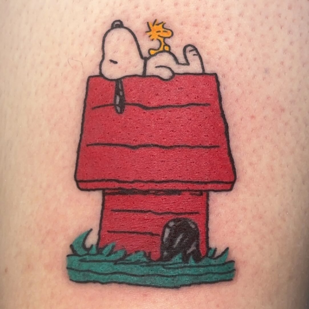 Snoopy and woodstock American traditional tattoo on the upper arm by ๐๐๐ฑ๐ฑ๐ฌ๐ฌ ๐๐ฏ๐ฑ๐ฆ๐ฐ๐ฑ