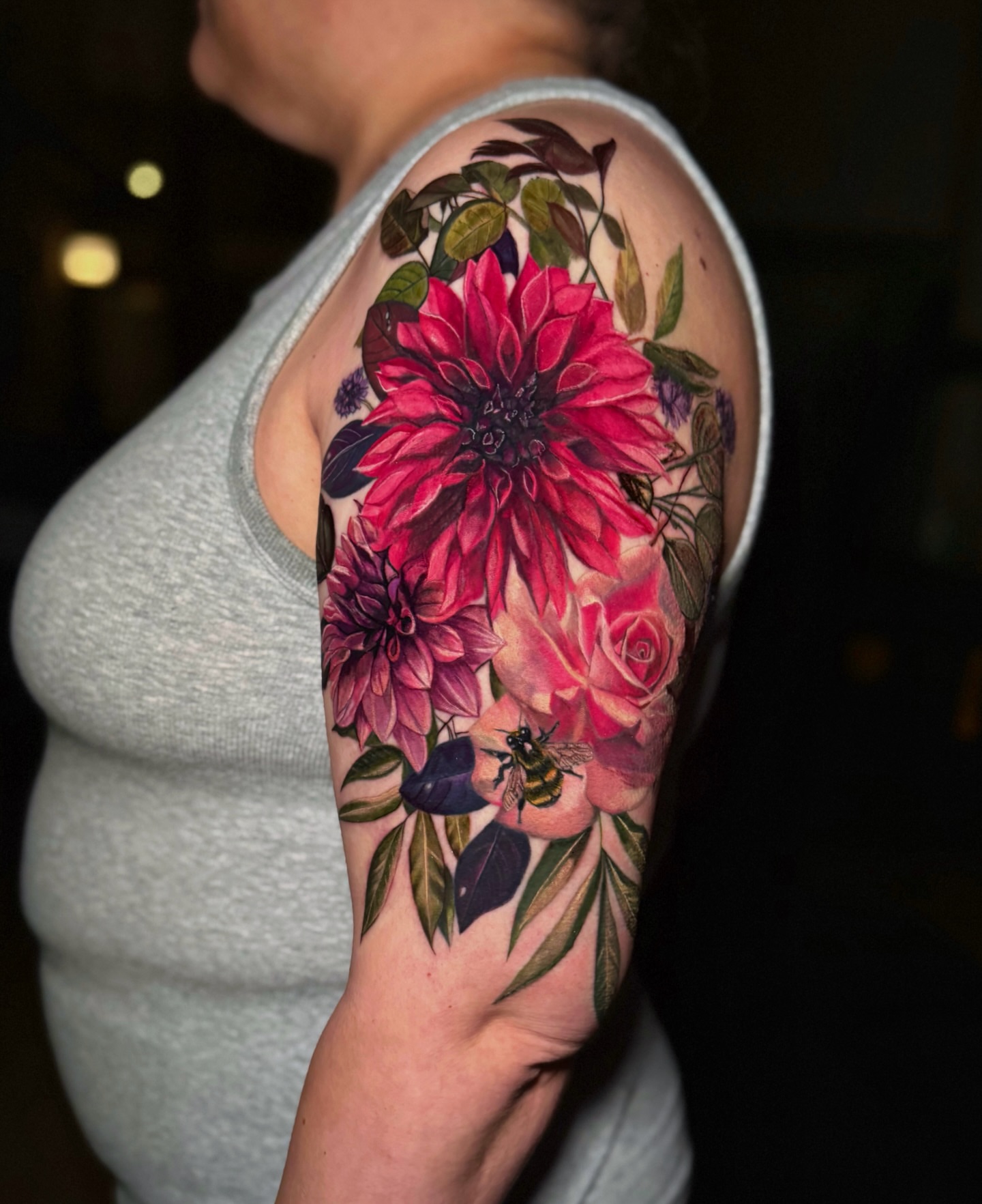 Floral bouquet realism tattoo on the upper arm by 𝕀𝕣𝕚𝕤 𝔸𝕣𝕖𝕝𝕝𝕒𝕟𝕠