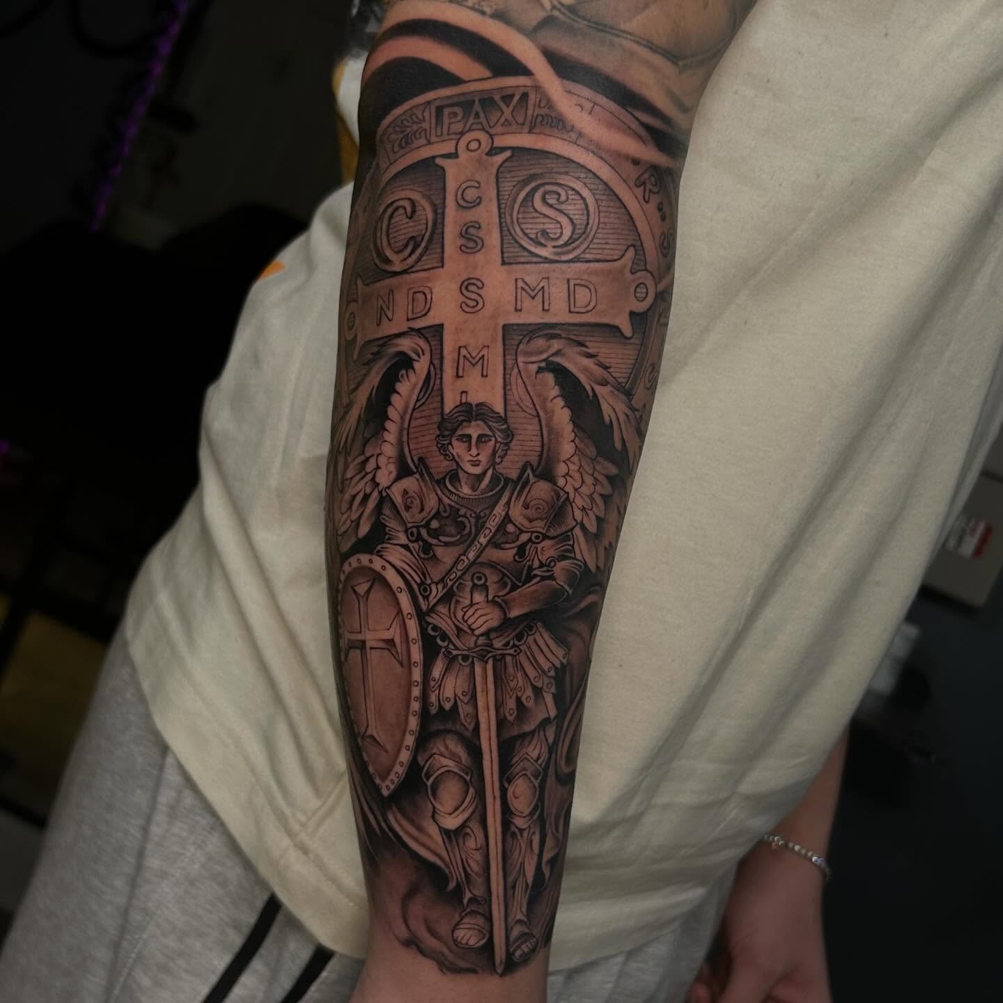 Angel with sword and shield realism tattoo on the forearm by Denis Morello de Castro, South River, New Jersey