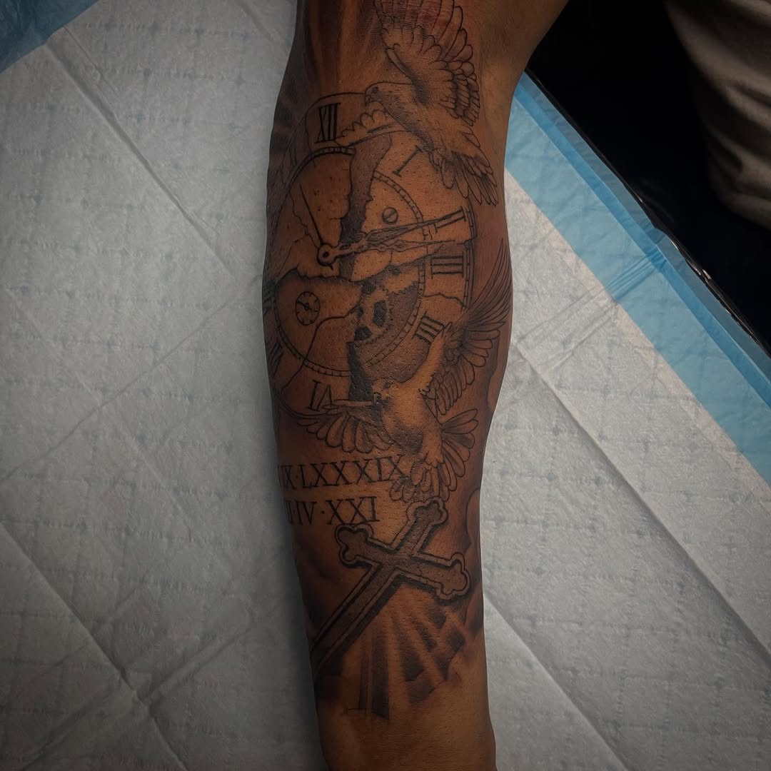 Clock, doves, and cross realism tattoo on the forearm by Chris Torres