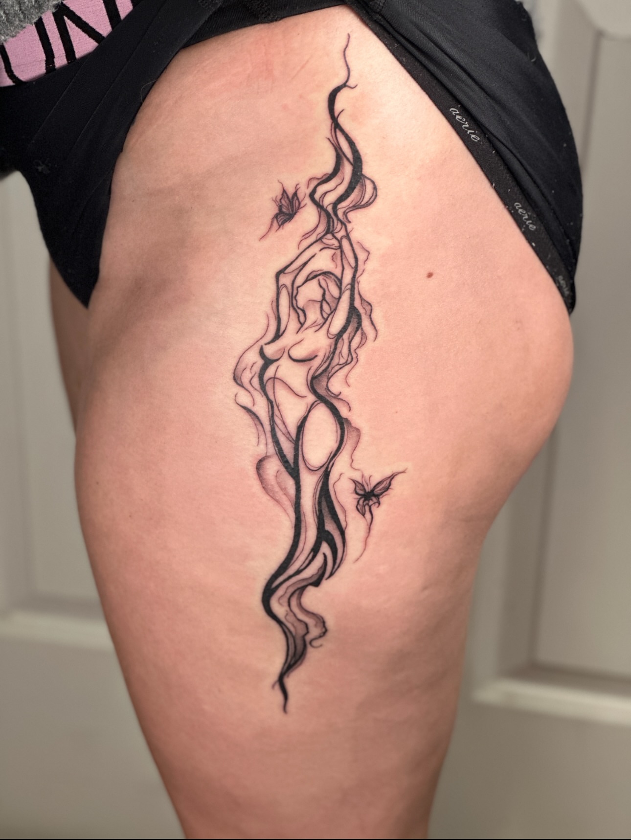 Female figure surrealism tattoo on the thigh by Nashville Tattoo Artist - Nicolette Madlyne
