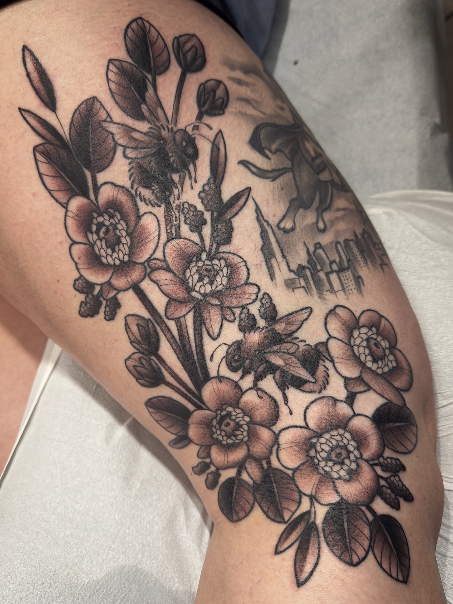Floral bouquet black and grey tattoo on the thigh by Amy Jean, Minneapolis, Minnesota