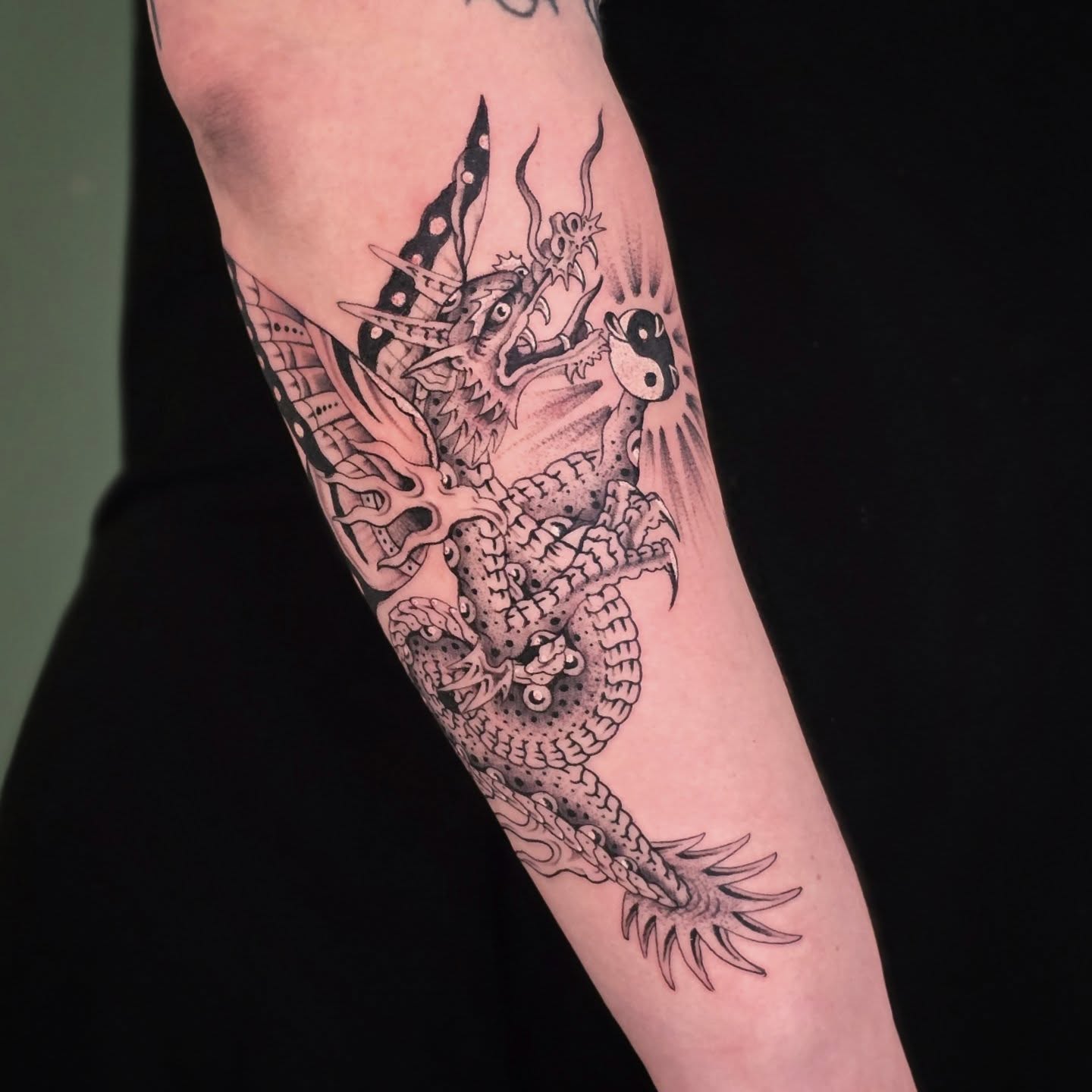 Dragon dotwork tattoo on the forearm by Aaron Dor
